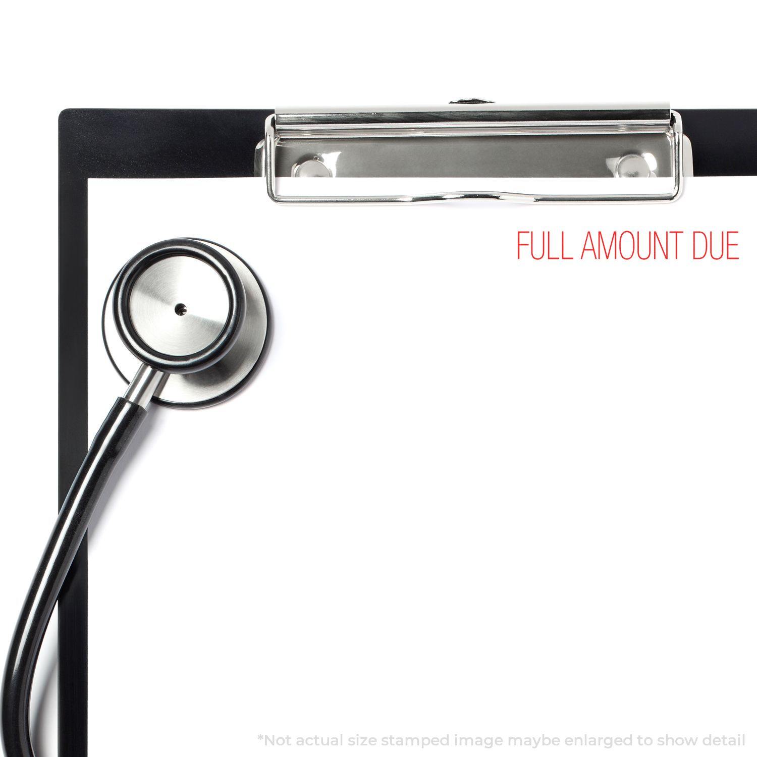 Clipboard with stethoscope and Large Self Inking Full Amount Due Stamp marking FULL AMOUNT DUE in red on a white paper.