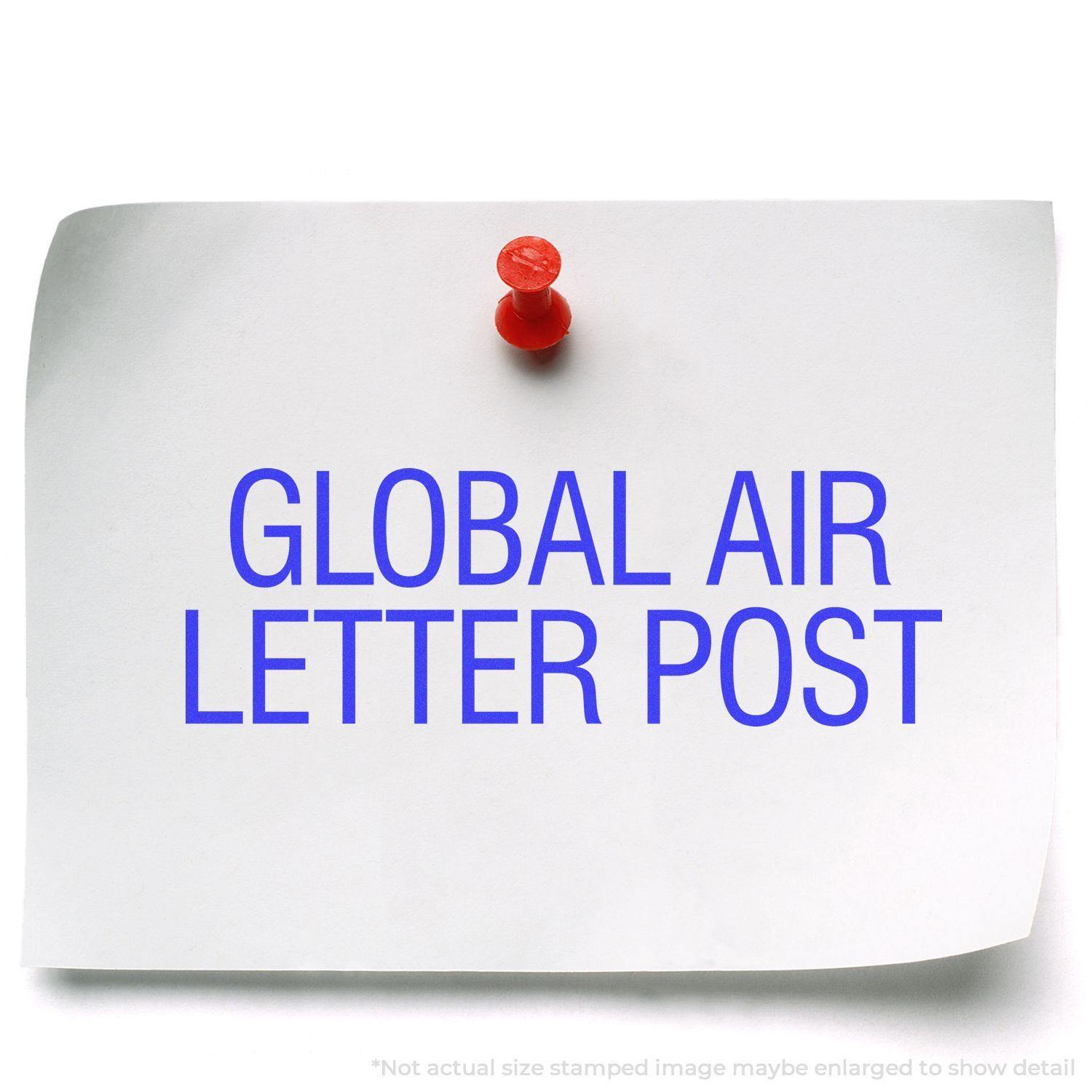 A white paper pinned with a red pushpin, stamped with GLOBAL AIR LETTER POST in blue ink using the Global Air Letter Post Rubber Stamp.