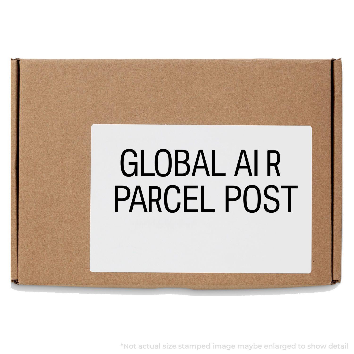 A self-inking stamp with a stamped image showing how the text "GLOBAL AIR PARCEL POST" in a large font is displayed by it after stamping.