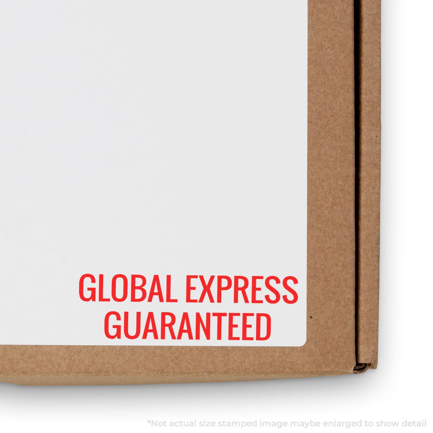 Large Self Inking Global Express Guaranteed Stamp in red ink on a white label attached to a brown cardboard box.