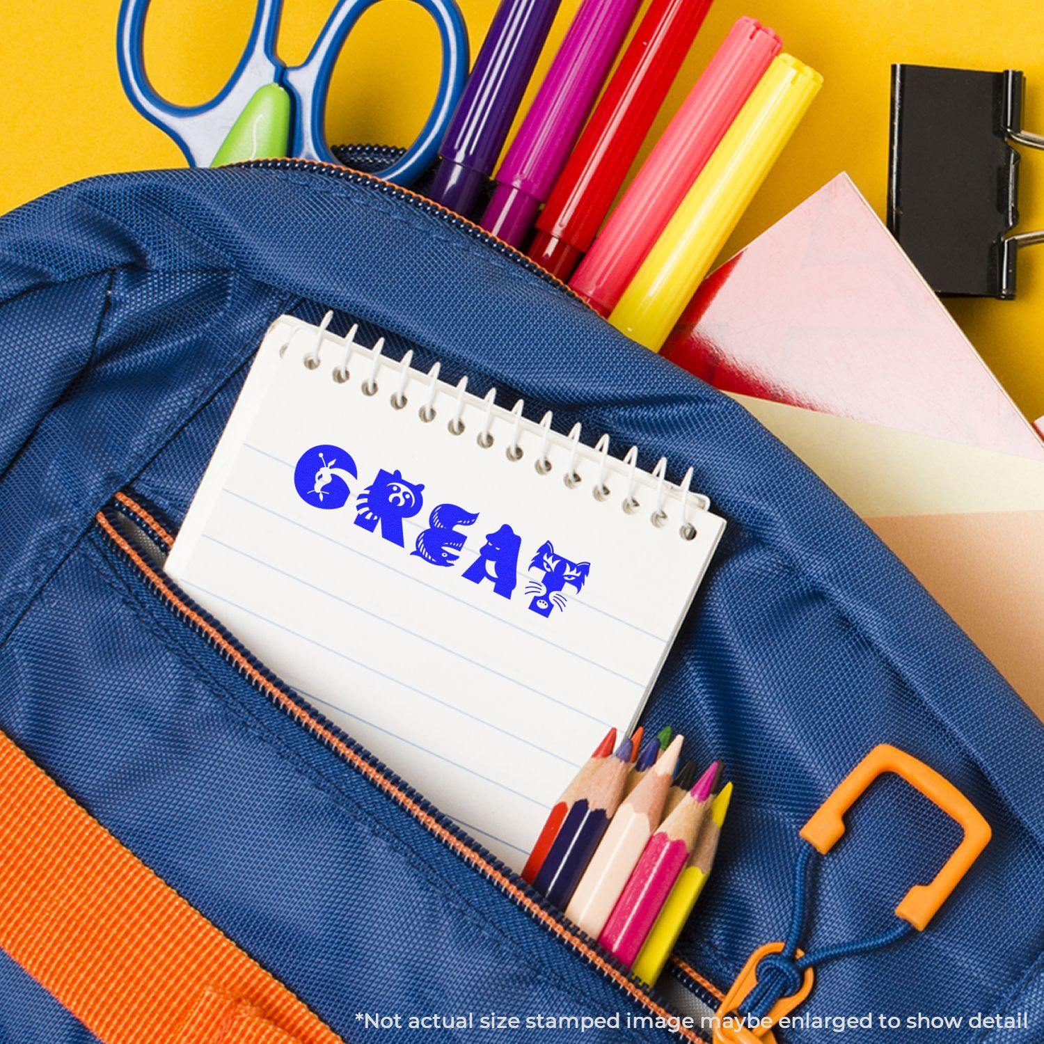 A blue backpack with colored pencils, markers, and a notepad stamped with GREAT using the Self Inking Great Stamp.