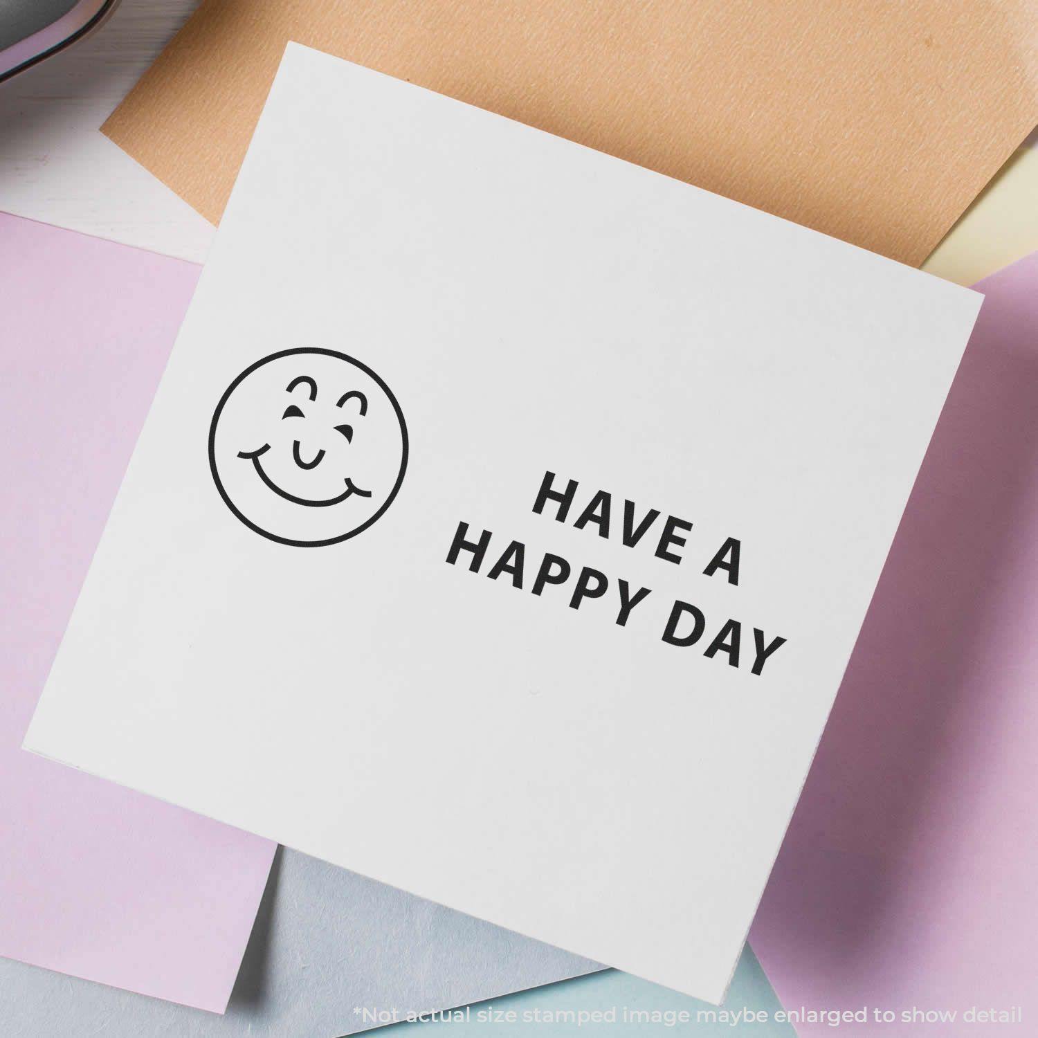 Have a Happy Day Rubber Stamp used on white paper with a smiling face and the text 'HAVE A HAPPY DAY' in black, surrounded by pastel papers.