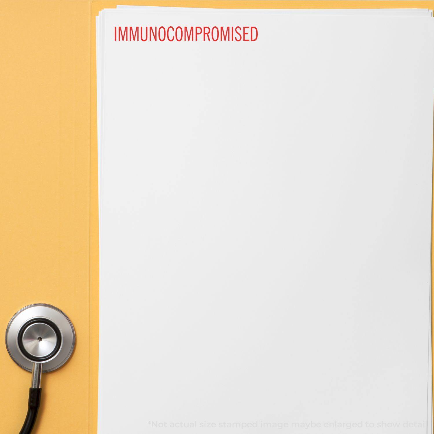 Self Inking Immunocompromised Stamp used on a white sheet of paper with a stethoscope nearby.