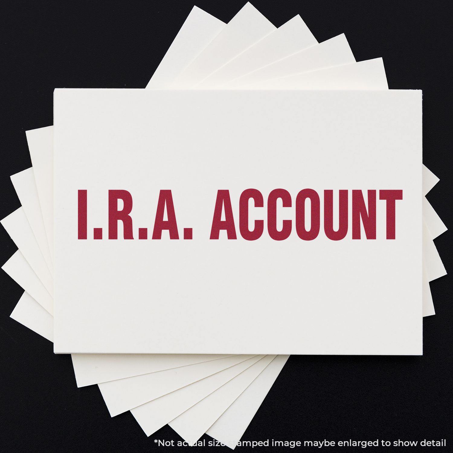 A stack of white cards stamped with I.R.A. ACCOUNT in bold red letters using the I.R.A. Account Rubber Stamp, displayed on a black background.