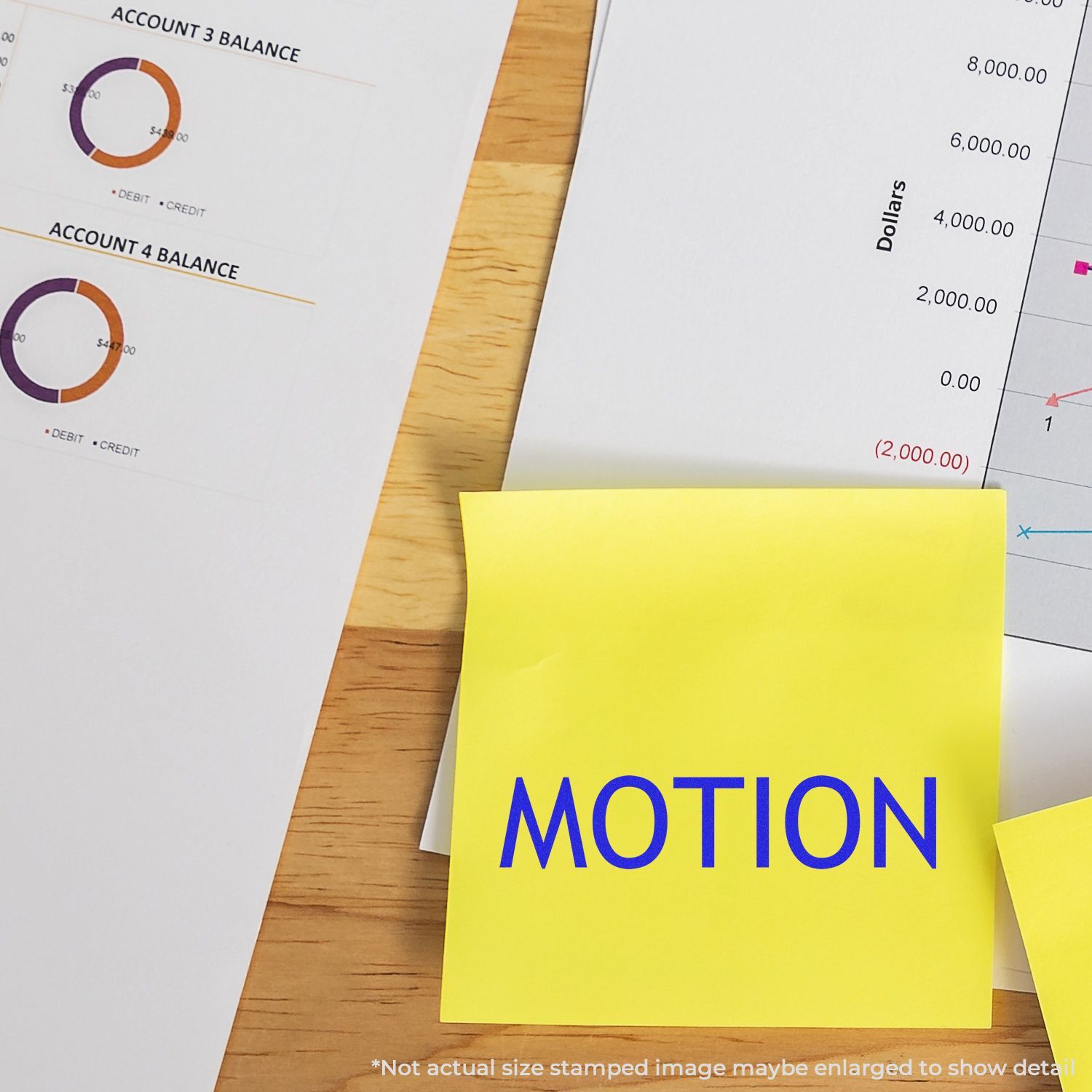 Self Inking Motion Stamp used on a yellow sticky note with financial documents and charts in the background.