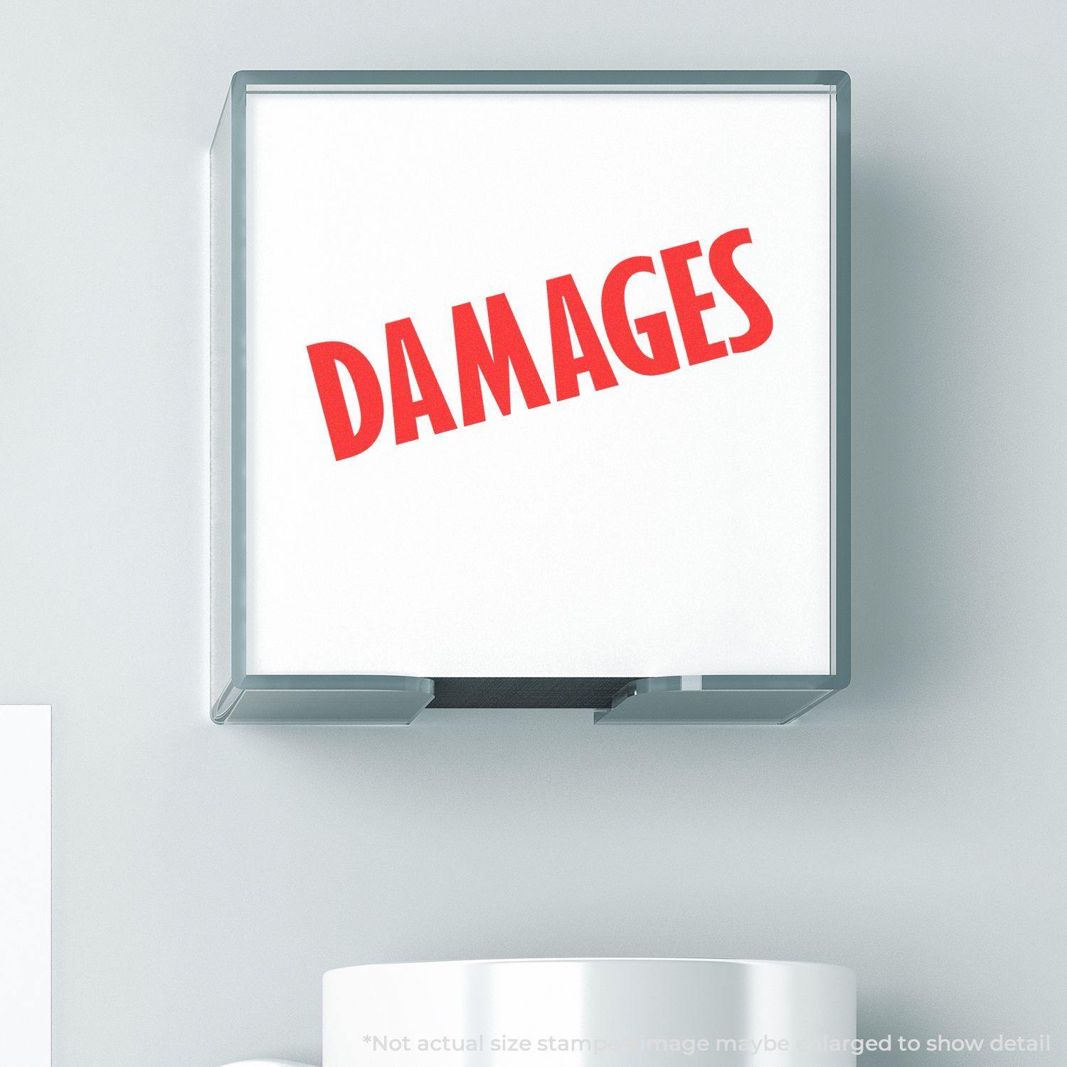 Large Damages Rubber Stamp with bold red text DAMAGES on a white background, shown in use on a desk.