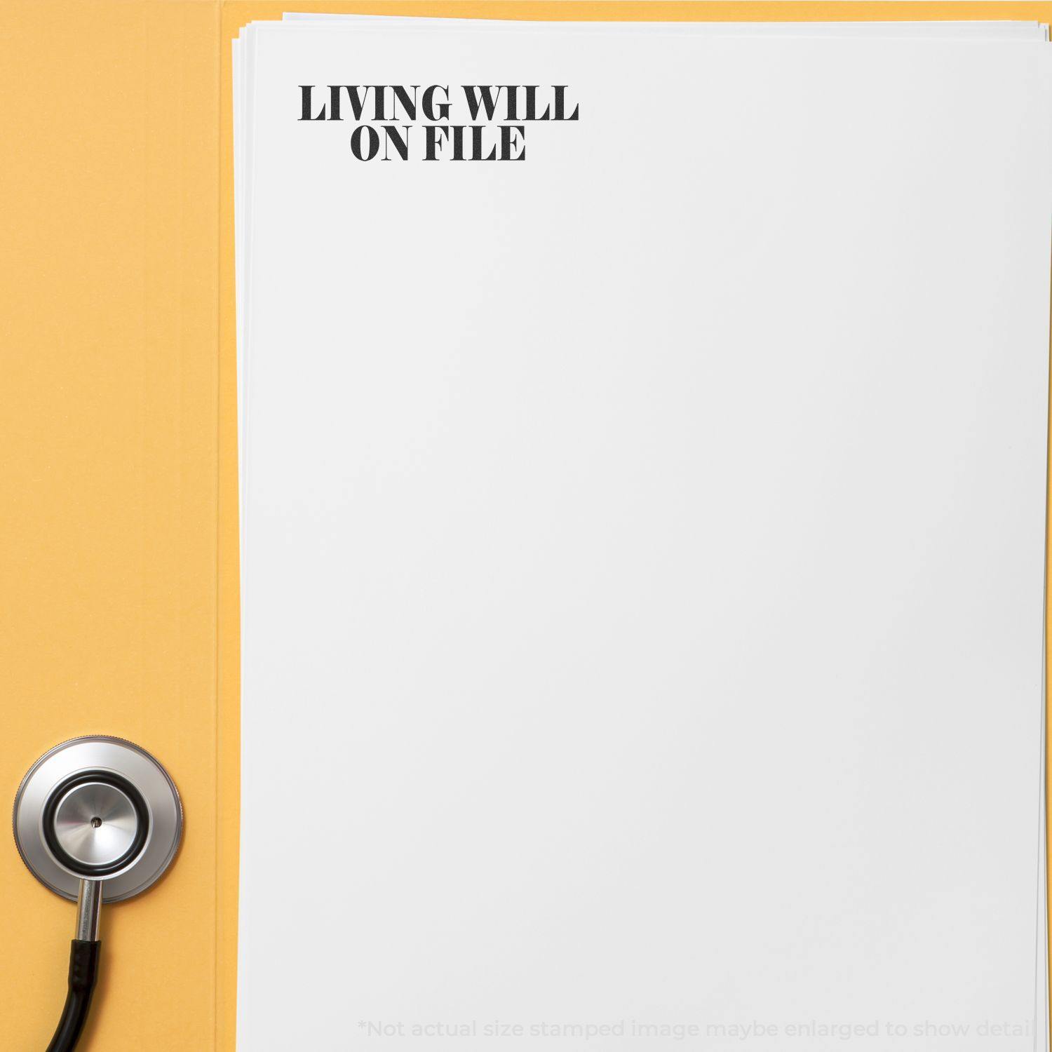 Large Living Will On File Rubber Stamp used on a stack of white papers, with a stethoscope placed beside the papers on a yellow surface.