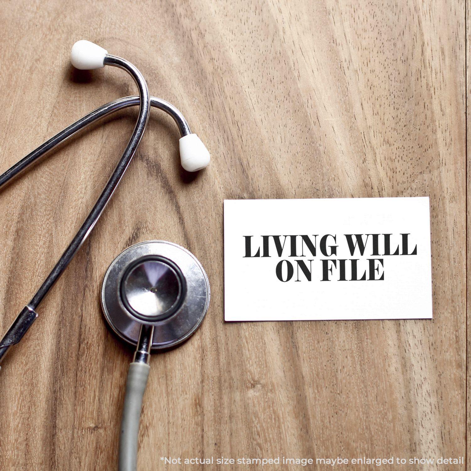 Stethoscope on a wooden surface next to a card with the text Living Will On File stamped in bold black letters.