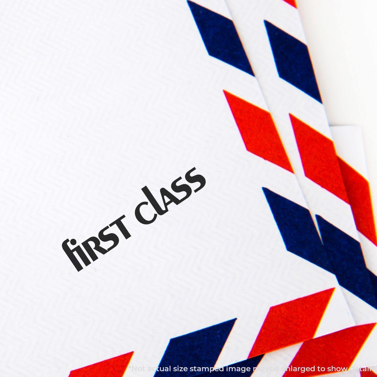 Lower case first class rubber stamp on a white envelope with red and blue diagonal stripes on the edges.