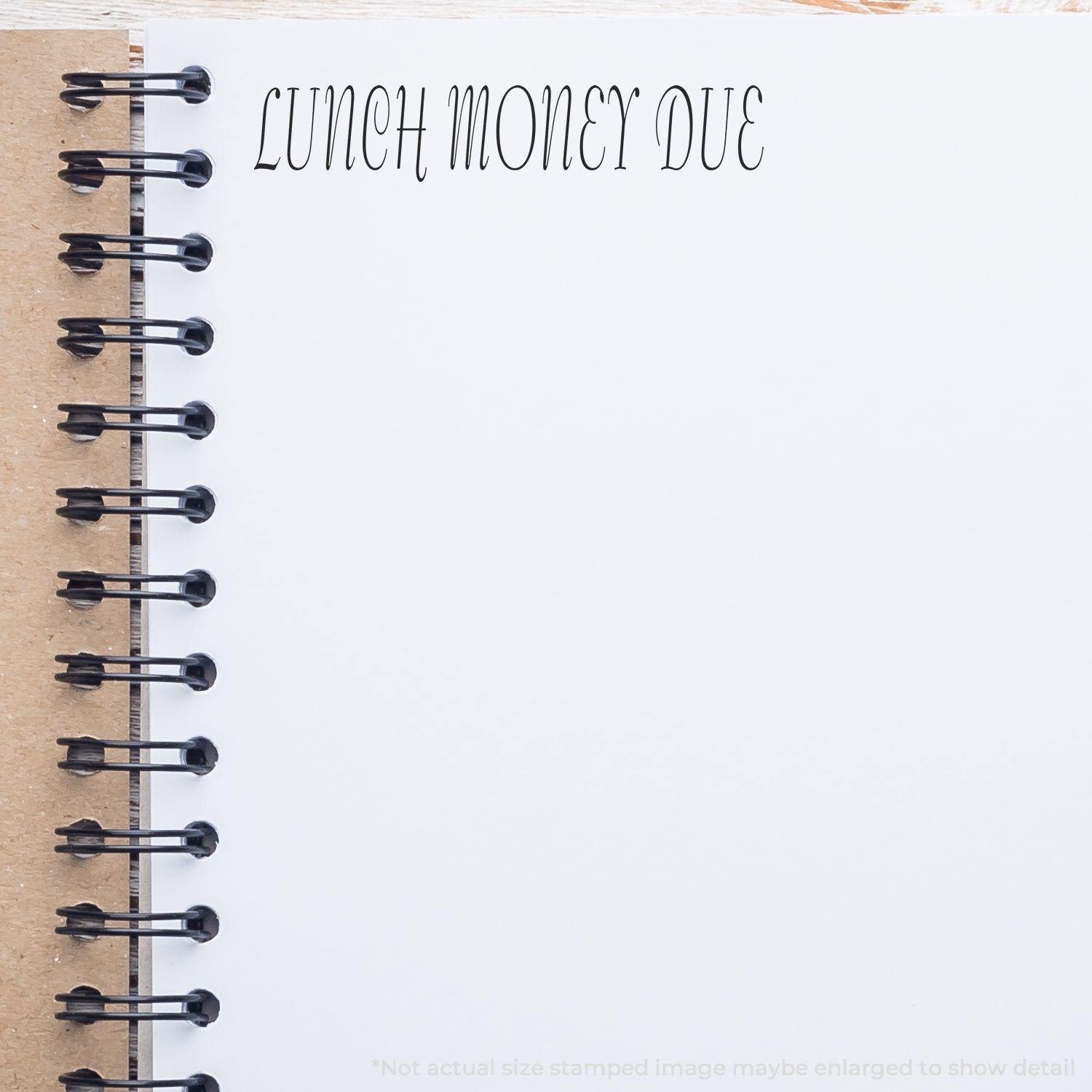 A notebook with LUNCH MONEY DUE stamped on a page using the Large Lunch Money Due Rubber Stamp.