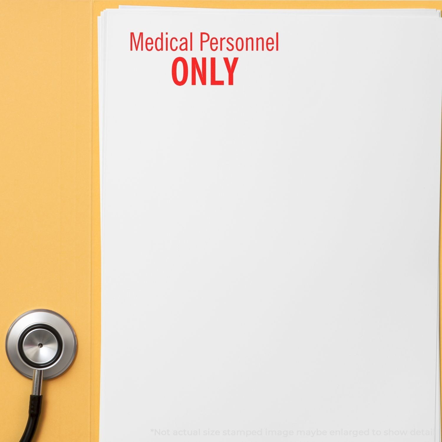 Self Inking Medical Personnel Only Stamp in red ink on a white paper, next to a stethoscope and a yellow folder.