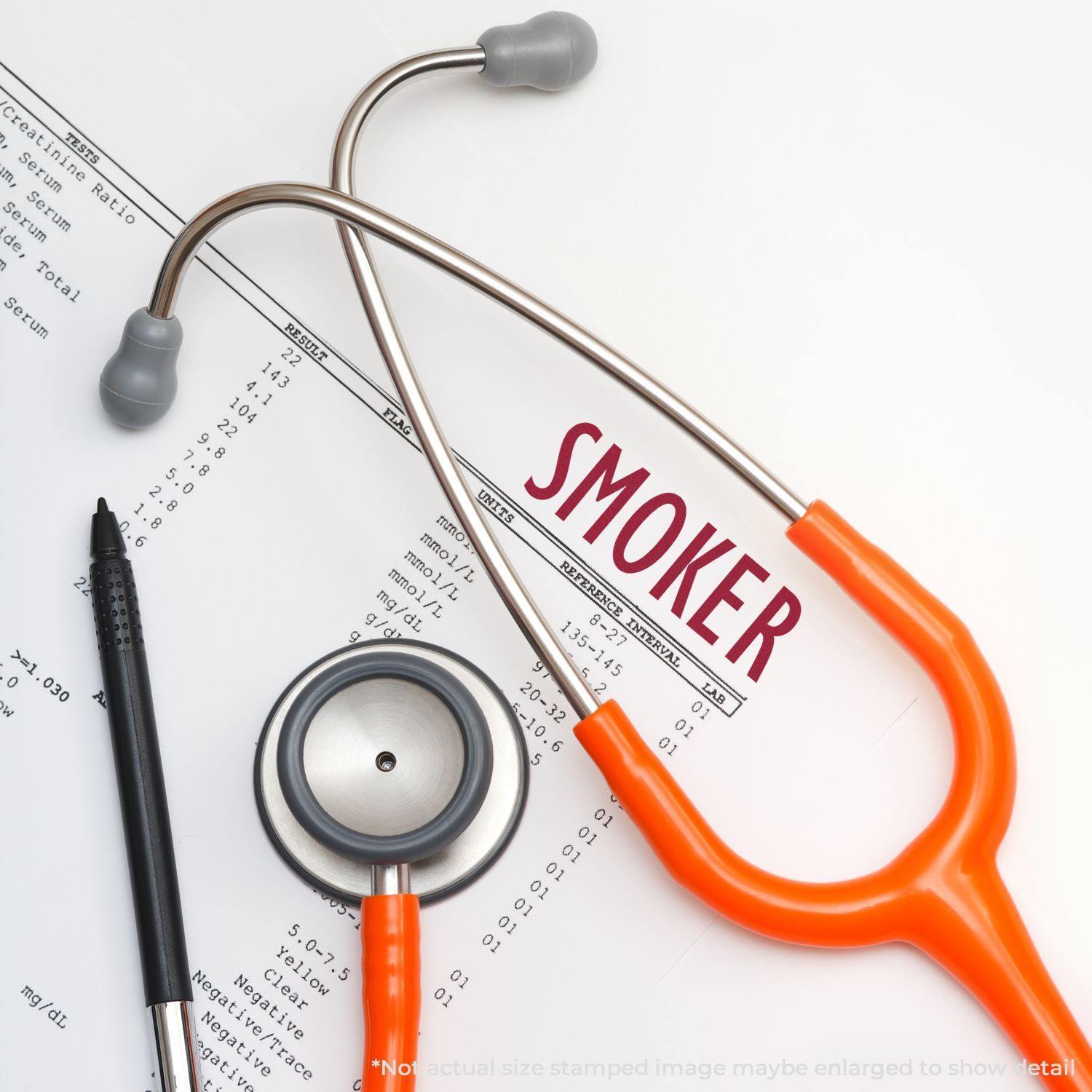 A Large Pre-Inked Smoker Stamp marks SMOKER on a medical document, surrounded by a stethoscope and pen.