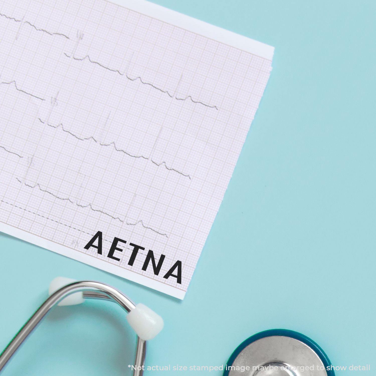 A Slim Pre-Inked Aetna Stamp marks a medical document on a light blue background, with a stethoscope partially visible.