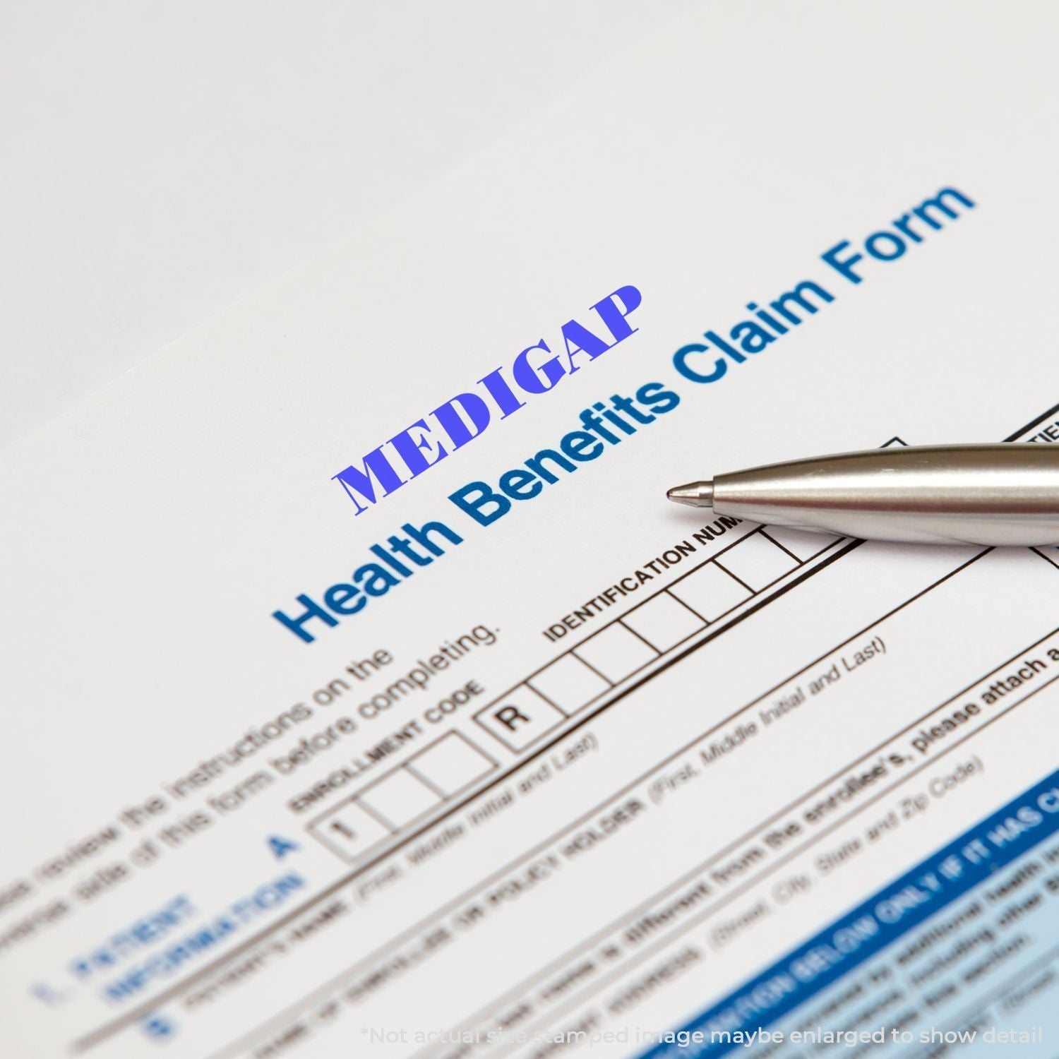 Self Inking Medigap Stamp marking MEDIGAP on a Health Benefits Claim Form with a pen pointing at the form.