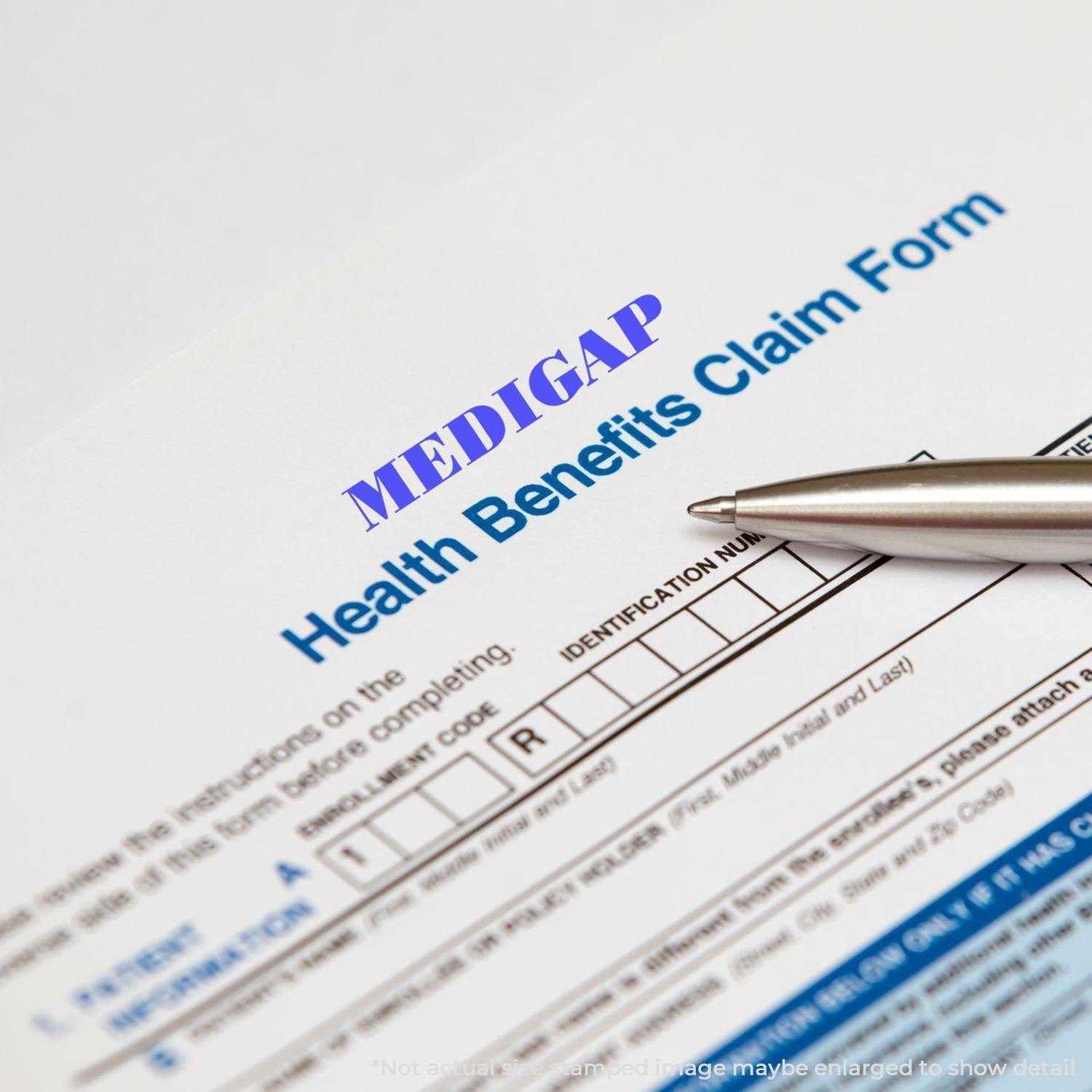 Medigap Rubber Stamp on a Health Benefits Claim Form with a pen pointing to the identification number section.