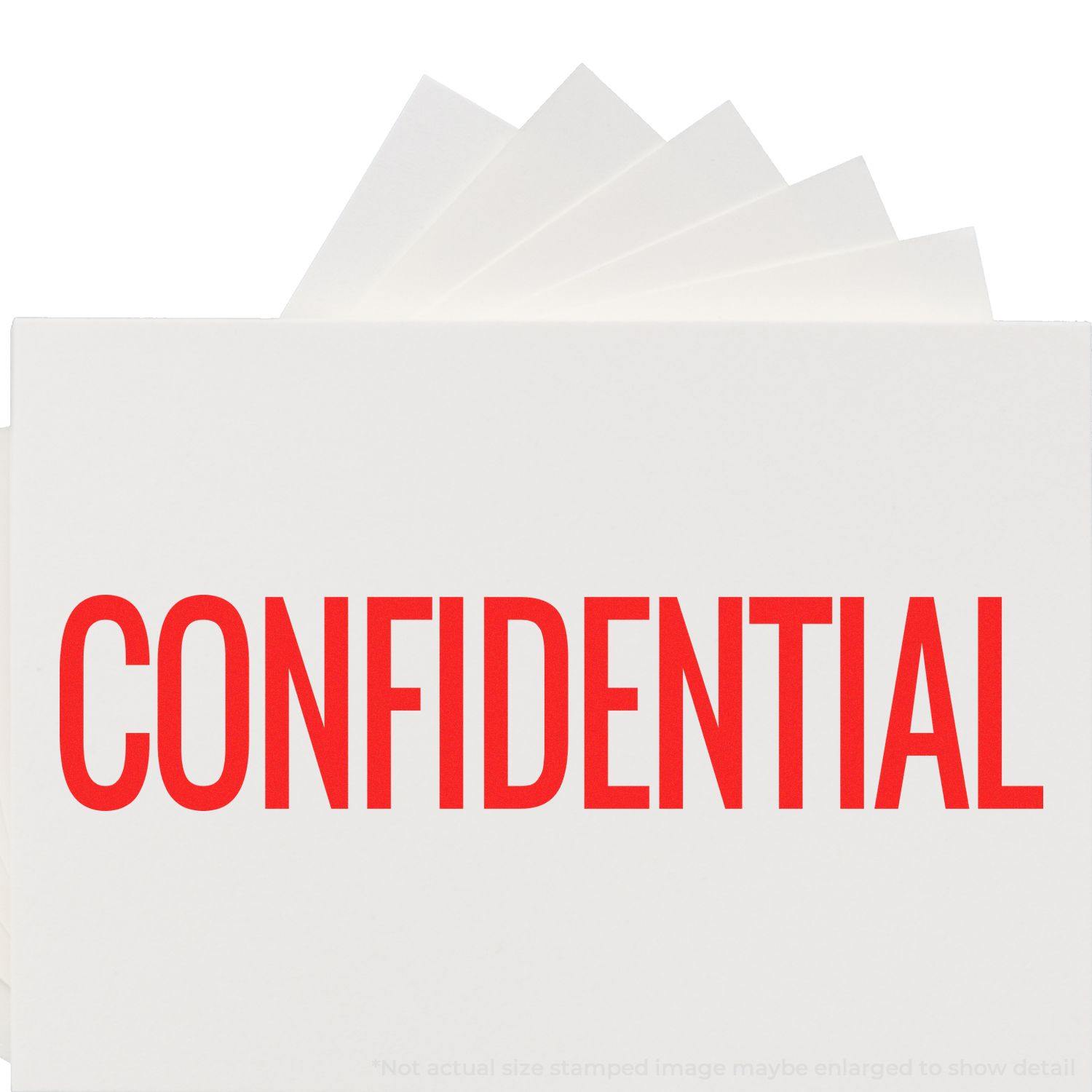 Large Narrow Confidential Rubber Stamp in use, stamping CONFIDENTIAL in bold red letters on white paper.