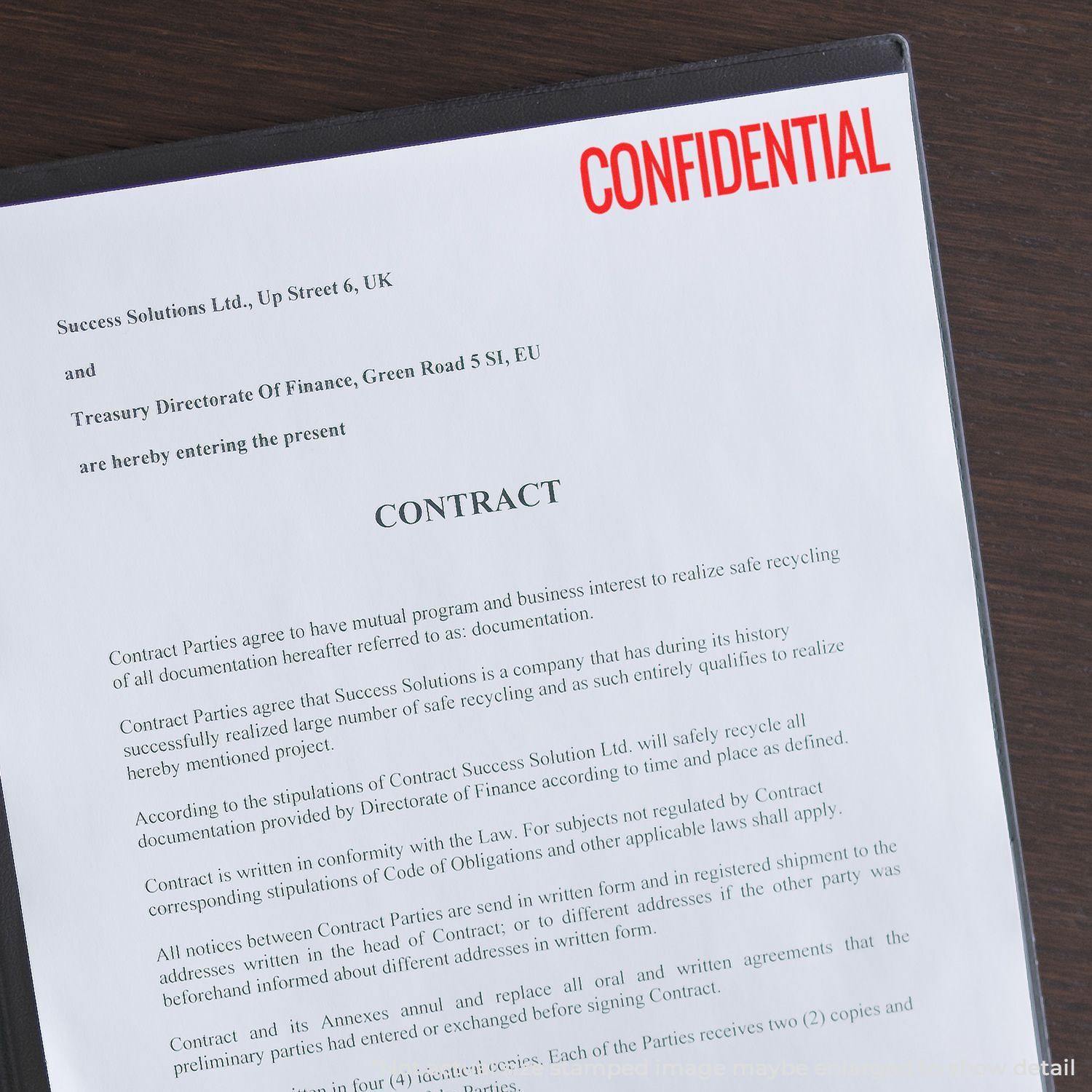 A document titled Contract with a red CONFIDENTIAL narrow rubber stamp mark on the top right corner.