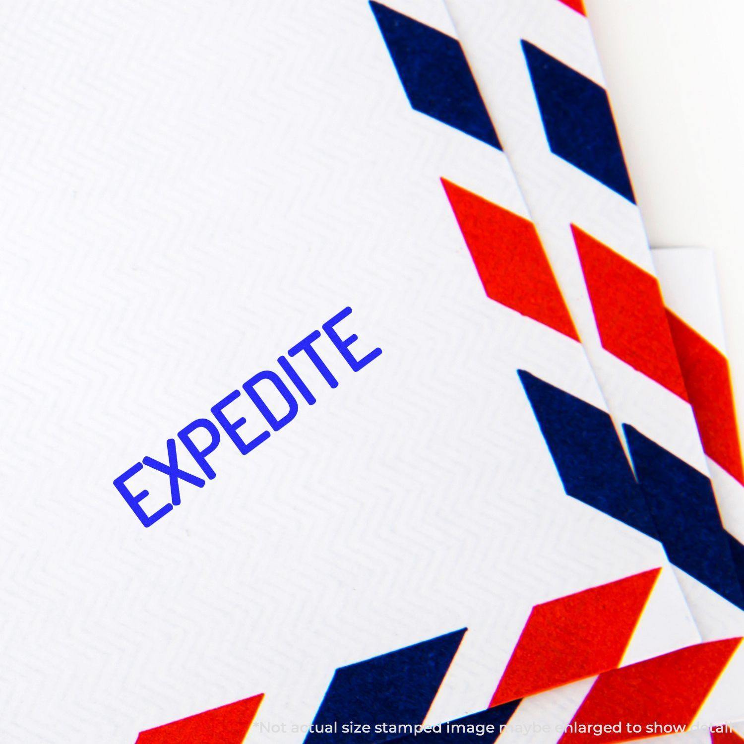 Envelope stamped with EXPEDITE using the Large Pre-Inked Narrow Expedite Stamp, featuring red and blue chevron patterns.