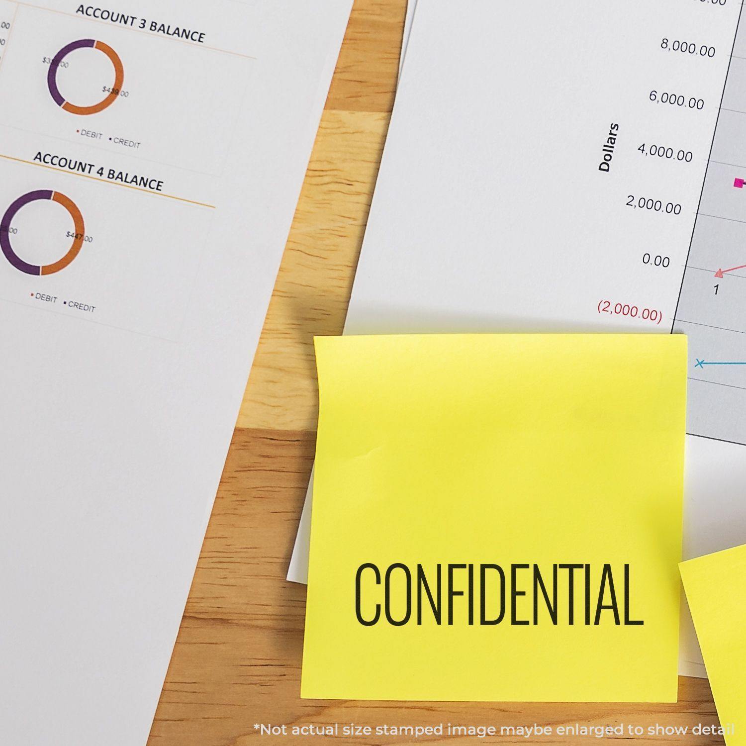 Yellow sticky note stamped with CONFIDENTIAL using the Large Narrow Font Confidential Rubber Stamp, placed on financial documents.