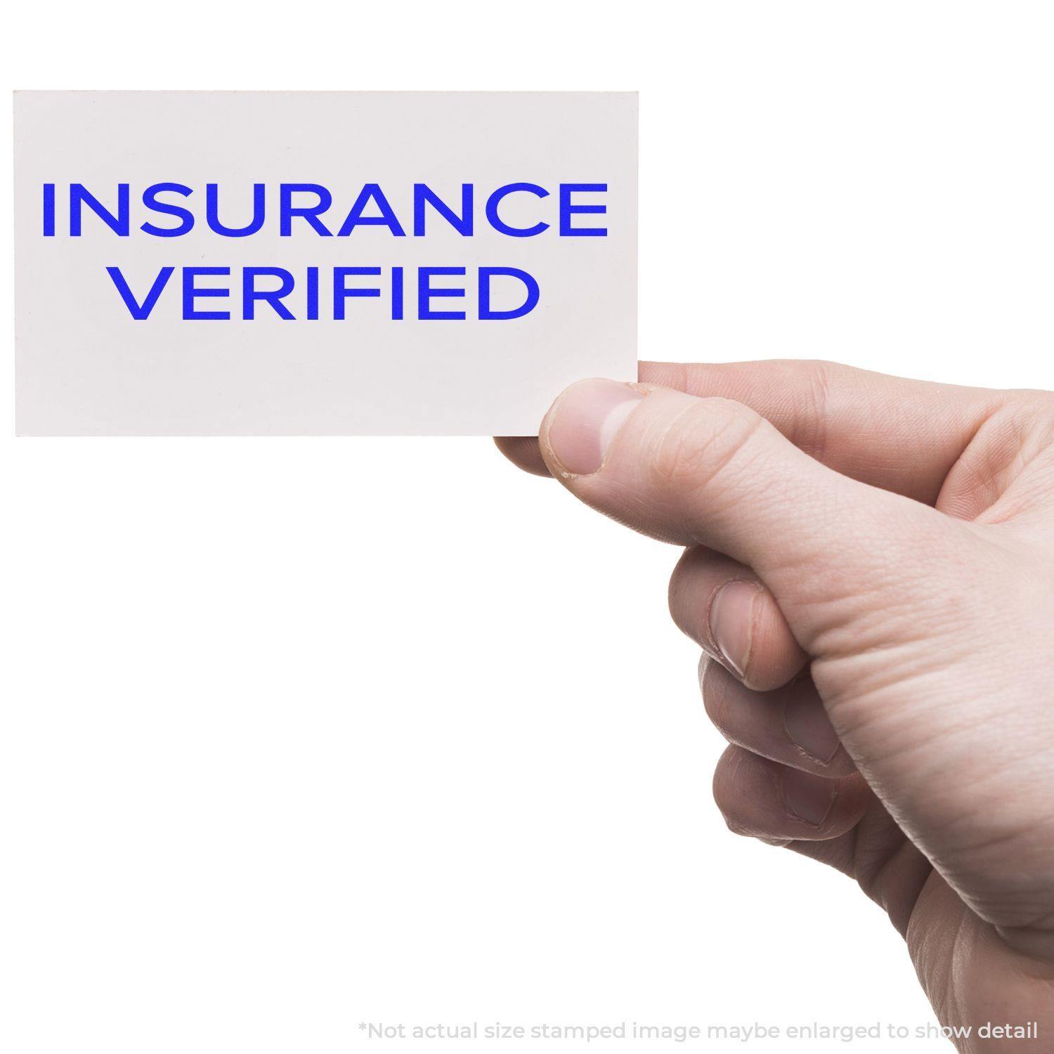 Hand holding a card stamped with INSURANCE VERIFIED using the Large Narrow Font Insurance Verified Rubber Stamp.