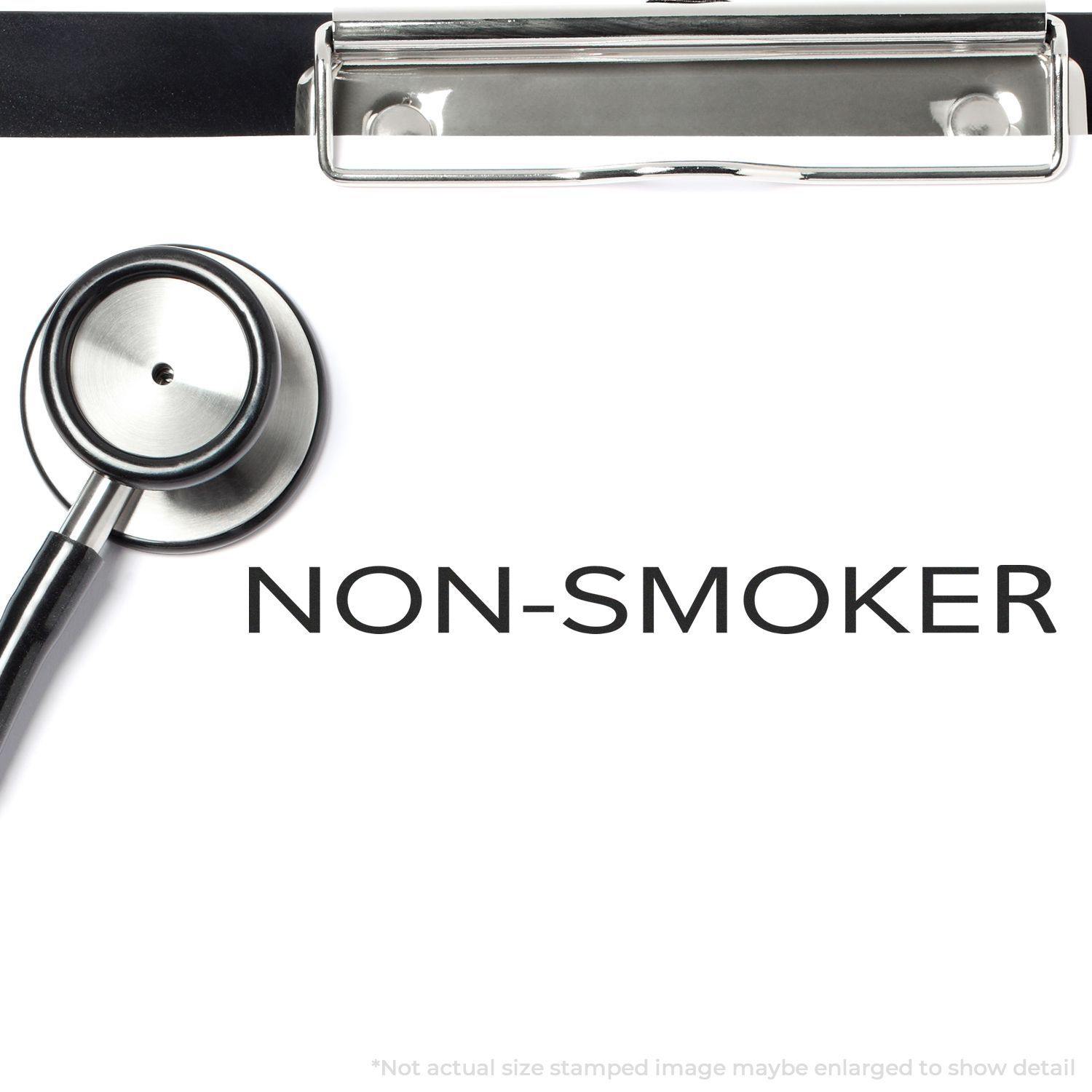 A stethoscope and clipboard with a stamped NON-SMOKER text using the Large Narrow Font Non-Smoker Rubber Stamp.