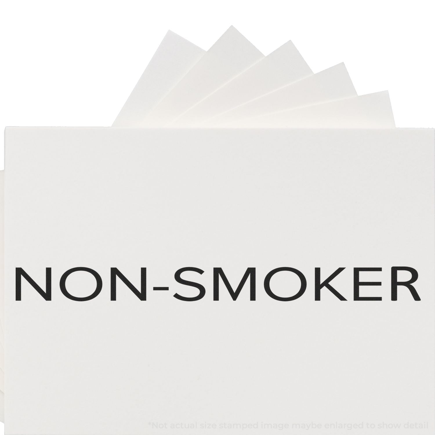 Self Inking Narrow Font Non-Smoker Stamp imprinting NON-SMOKER on white paper, showcasing clear and bold text.