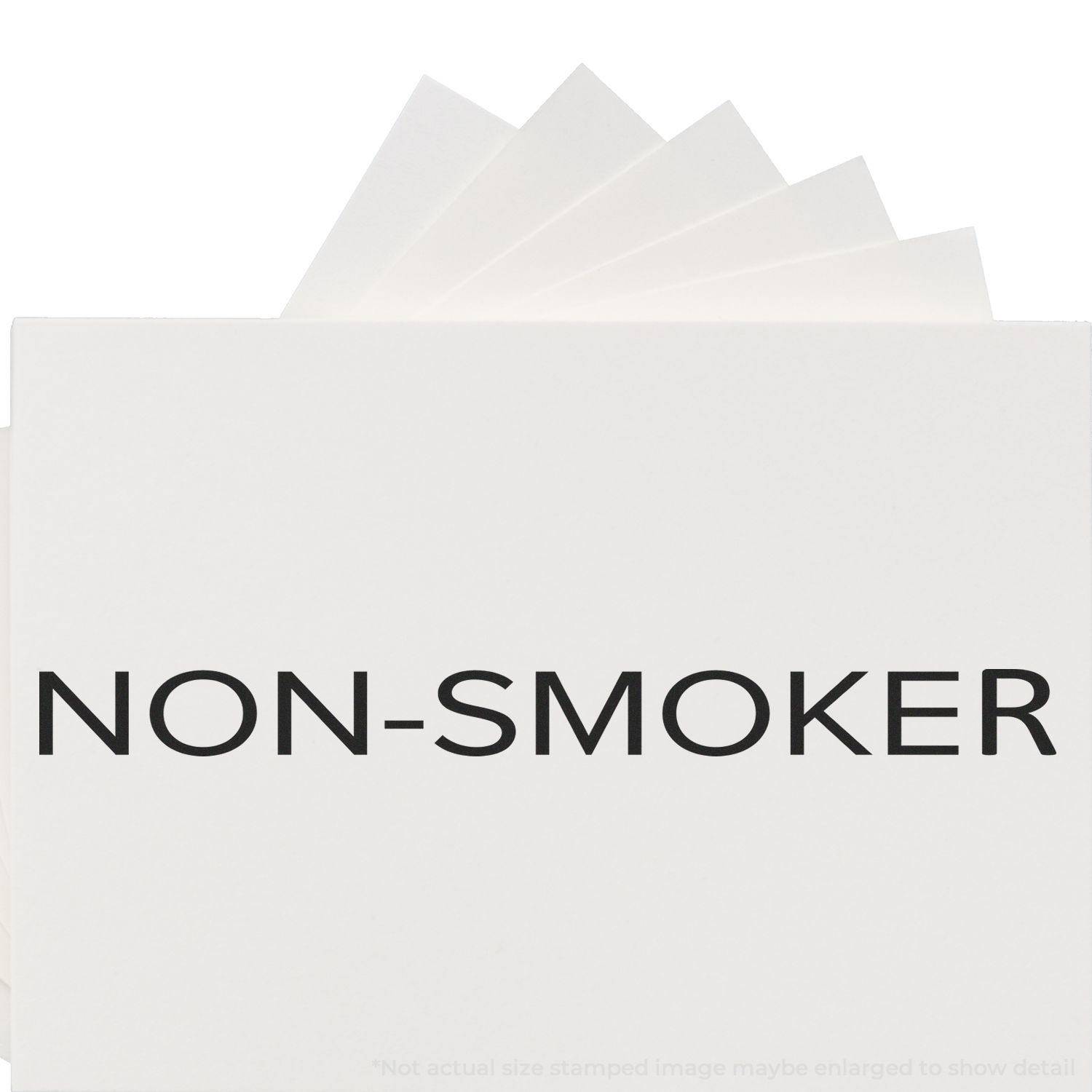 Large Pre-Inked Narrow Font Non-Smoker Stamp imprint on white paper, showing clear and bold NON-SMOKER text.