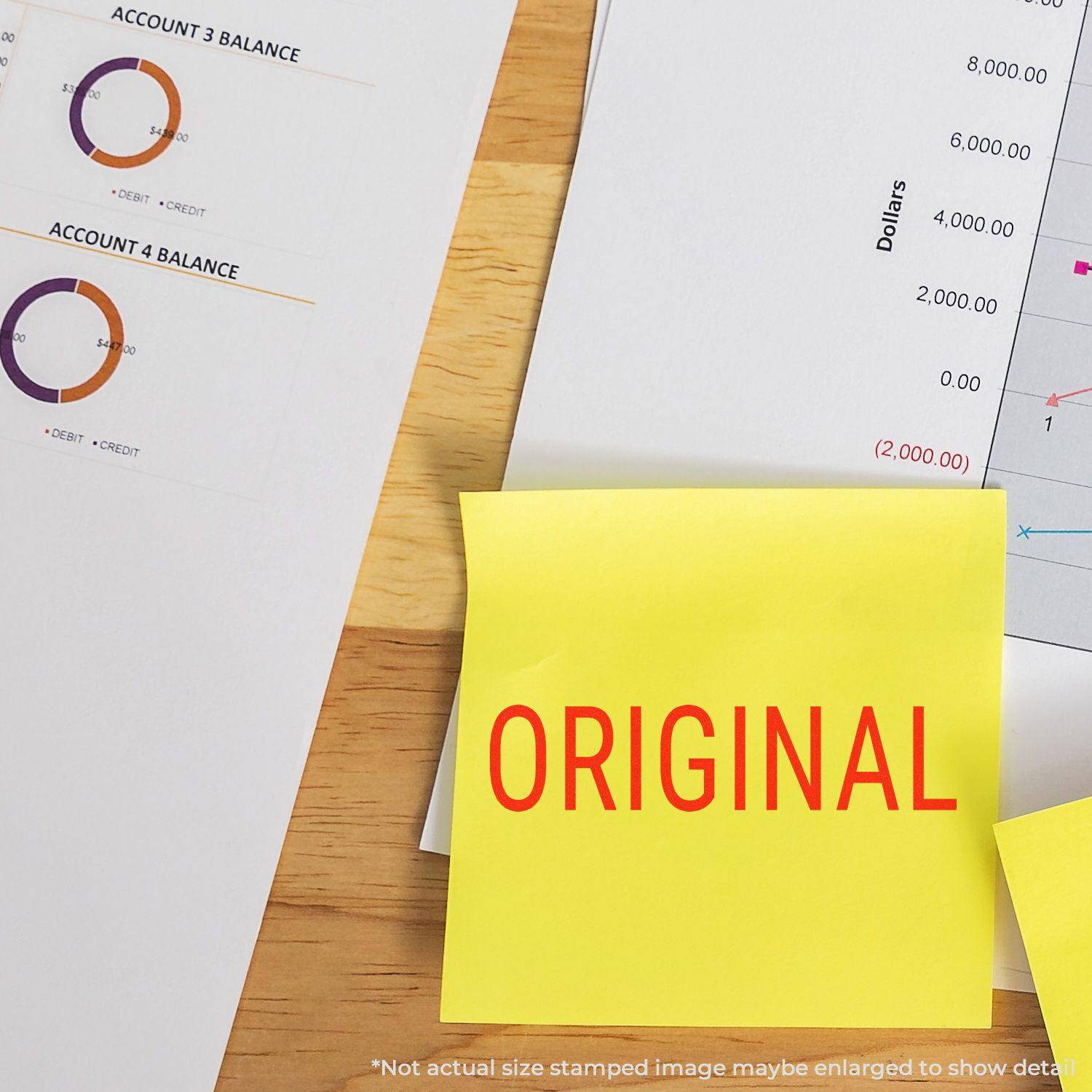 Large Pre-Inked Narrow Font Original Stamp marking ORIGINAL in red on a yellow sticky note, placed on financial documents.