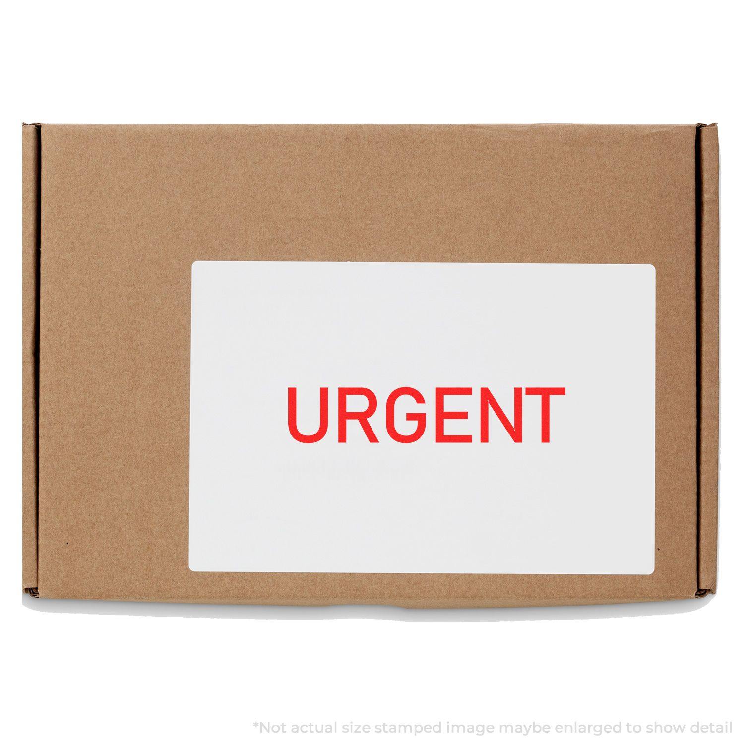 Cardboard box with a white label stamped URGENT in red using the Large Self Inking Narrow Font Urgent Stamp.