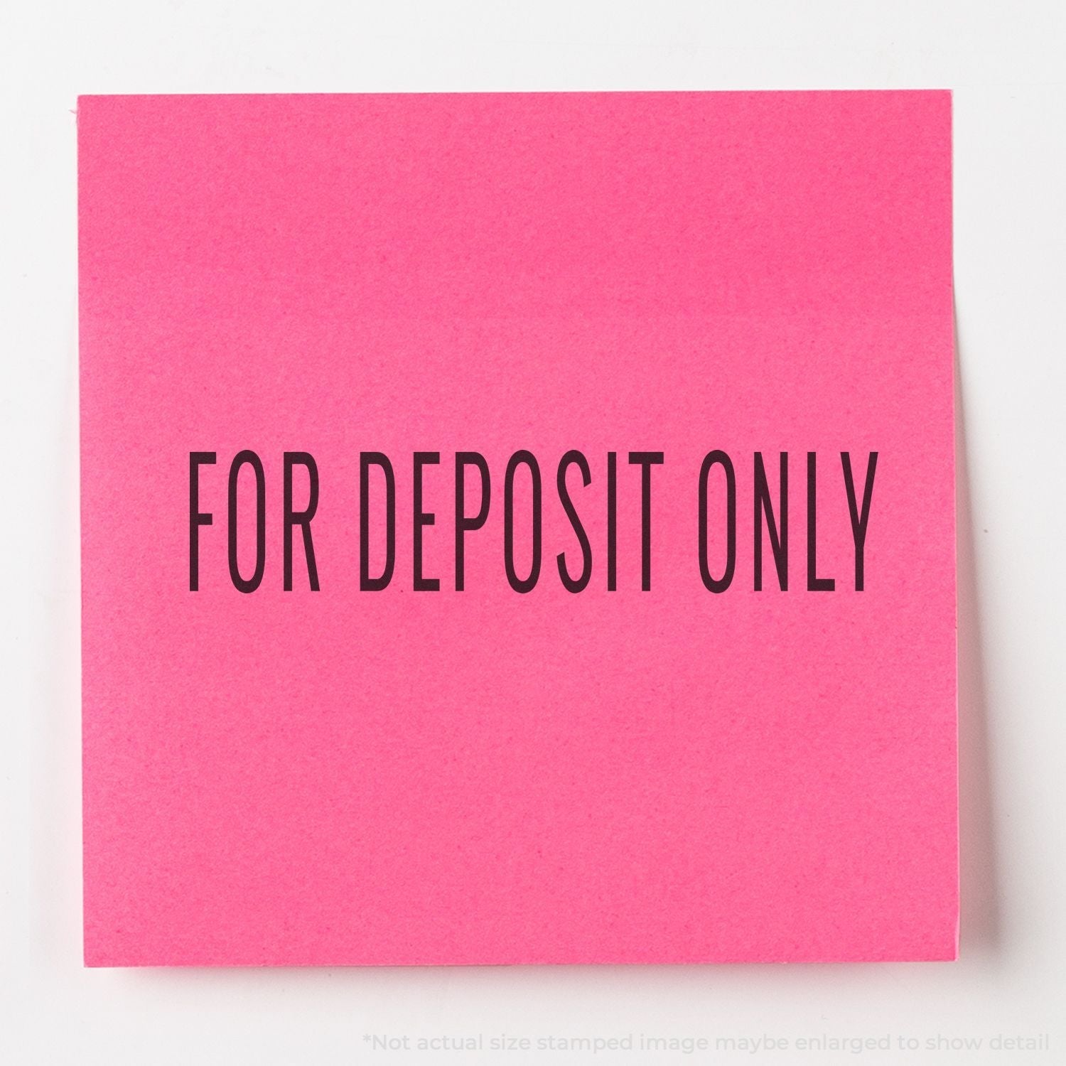 A self-inking stamp with a stamped image showing how the text "FOR DEPOSIT ONLY" in a narrow font is displayed after stamping.
