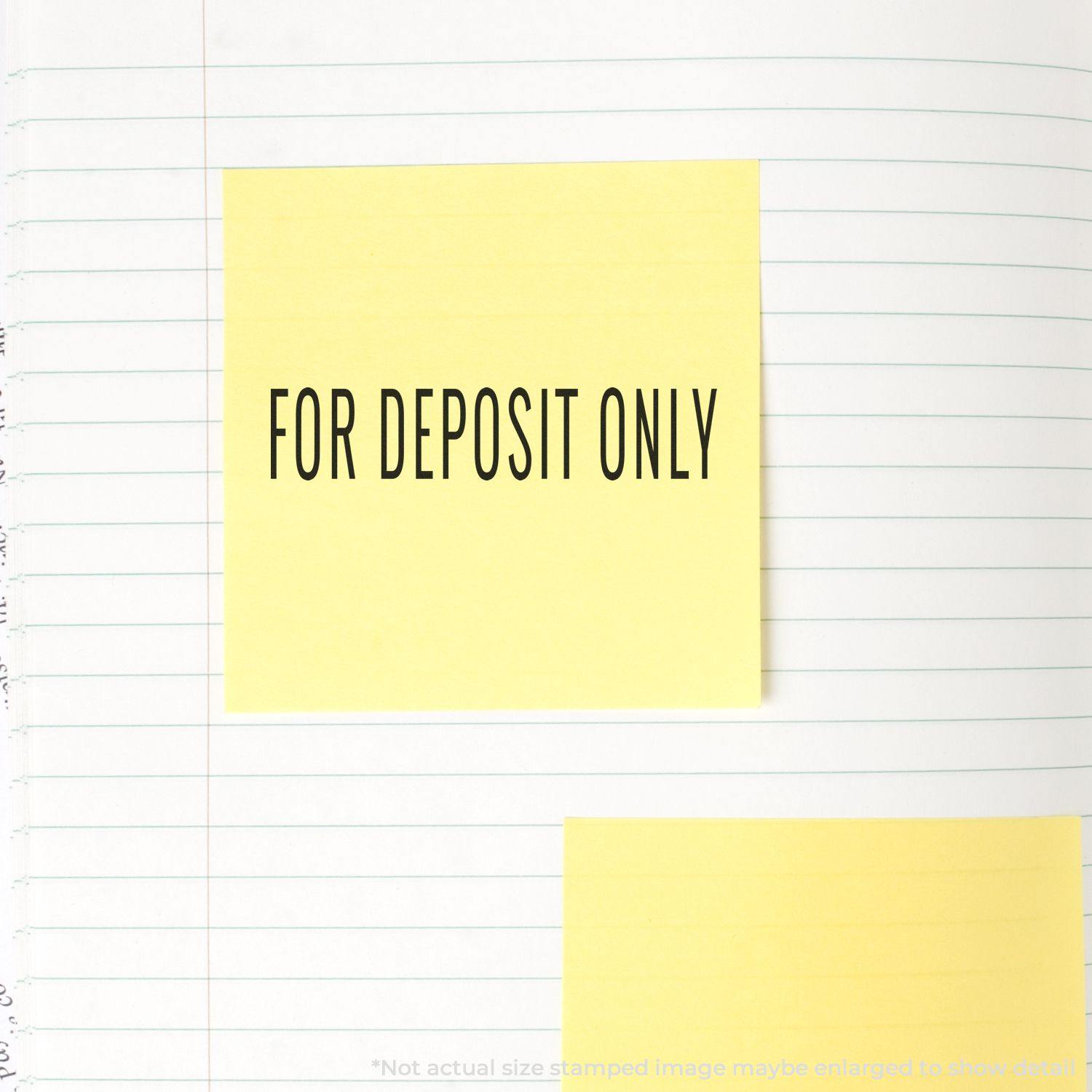 Large Narrow For Deposit Only Rubber Stamp used on a yellow sticky note placed on a lined notebook page.