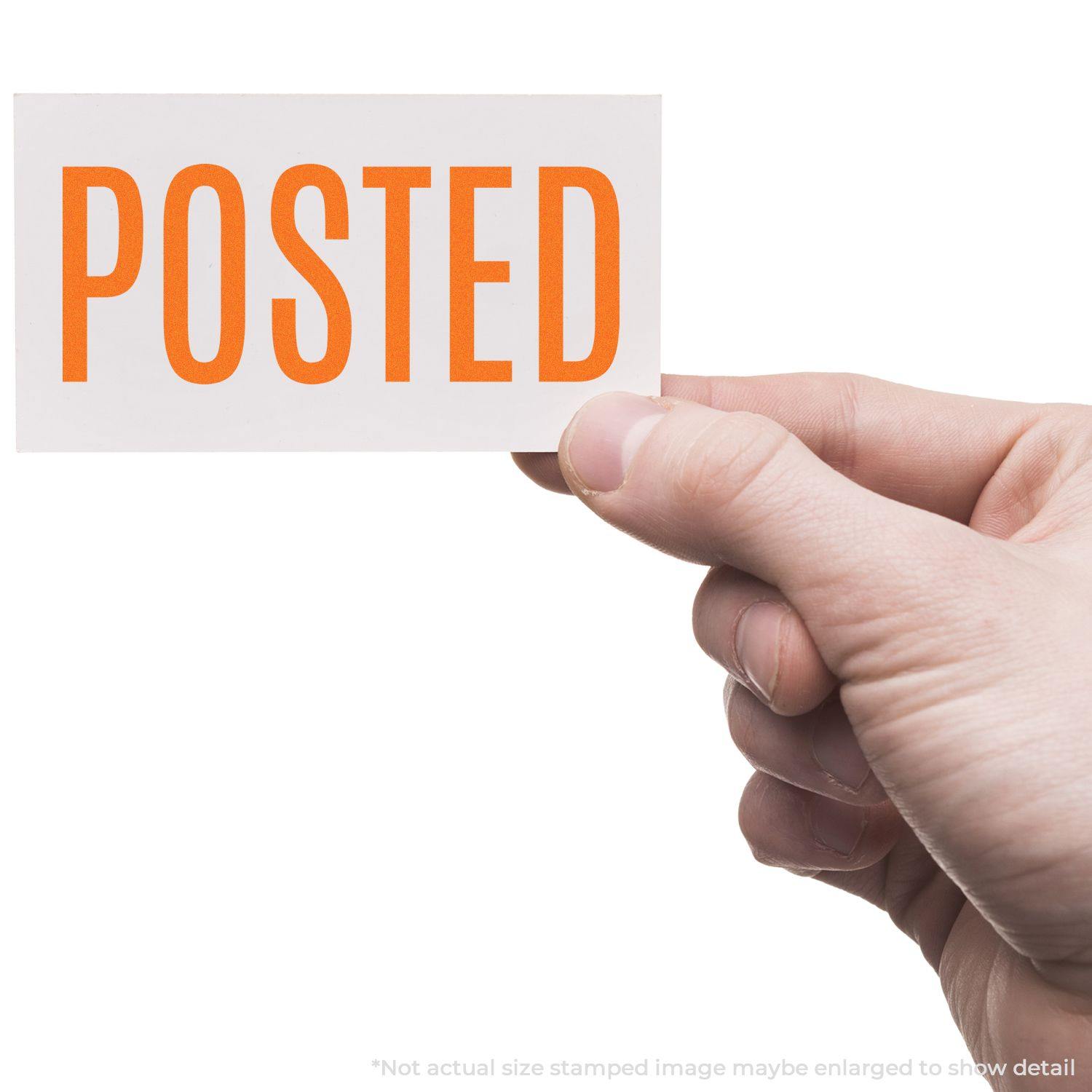 Hand holding a Large Narrow Posted Rubber Stamp imprint with the word POSTED in bold orange letters on a white background.