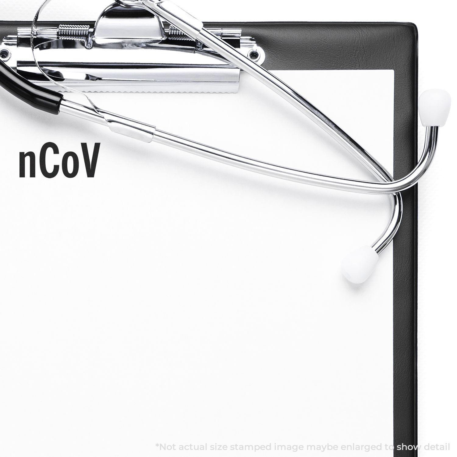 A clipboard with a stethoscope and a Large nCov Rubber Stamp imprint on a white paper.