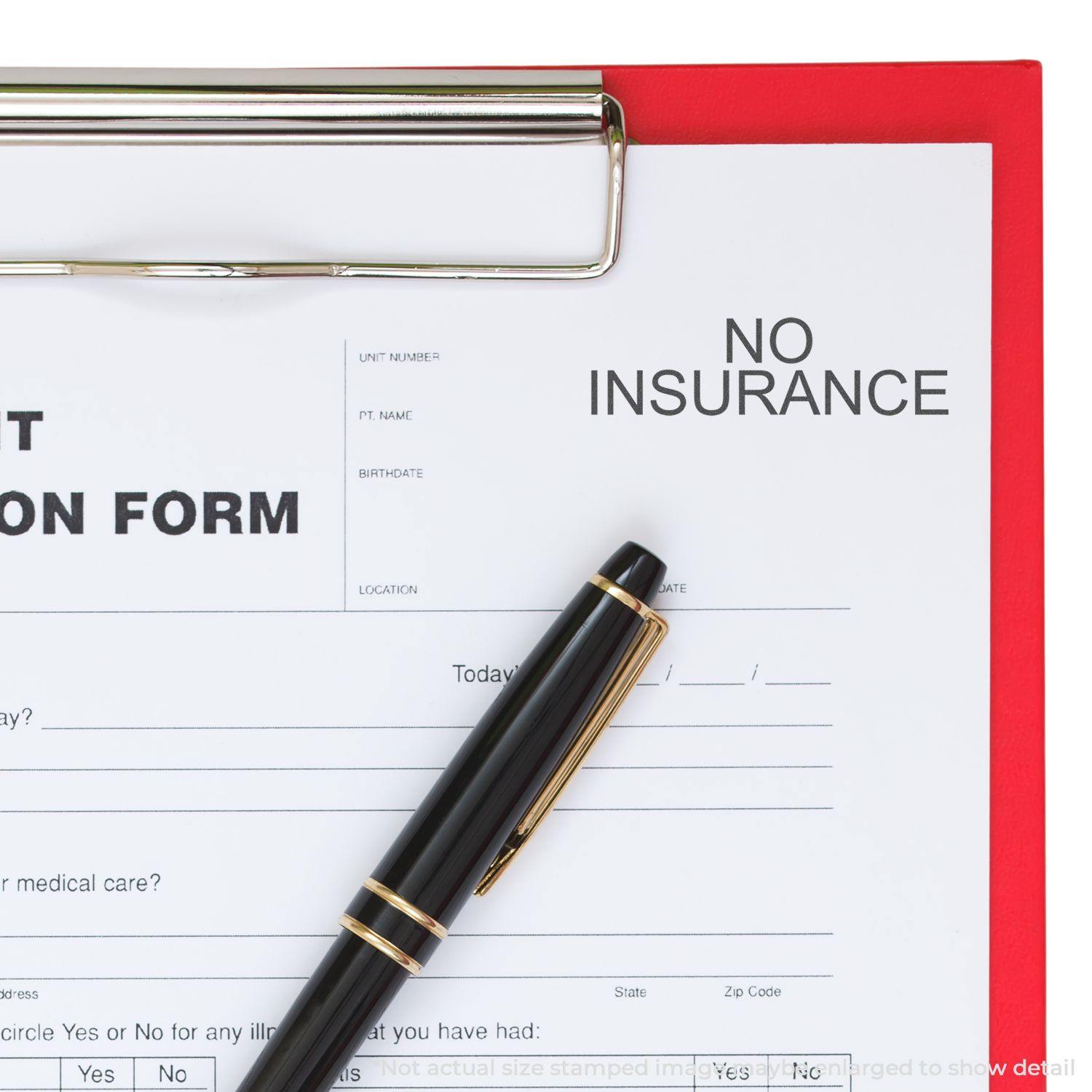 A clipboard with a form stamped NO INSURANCE using the Large Self Inking No Insurance Stamp, with a black pen placed on the form.