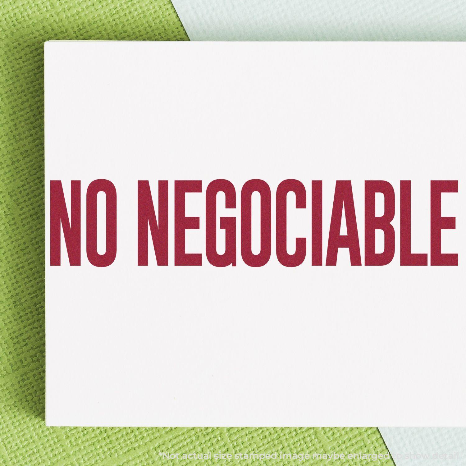 No Negociable Rubber Stamp in red ink on white paper, placed on a green and white textured background.