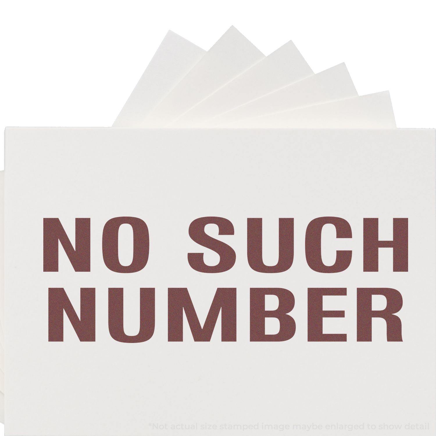 Large No Such Number Rubber Stamp in use, stamping NO SUCH NUMBER in bold red letters on white paper.