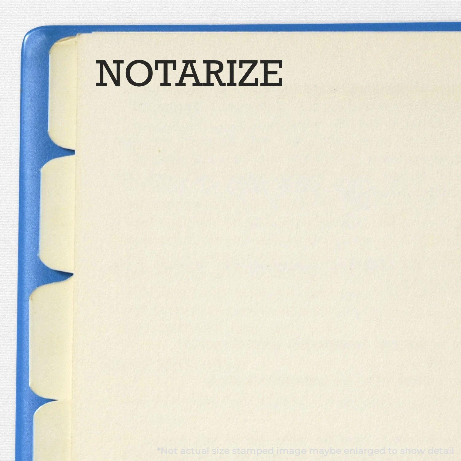 Notarize rubber stamp impression on a blank page with blue tabbed dividers on the left side.