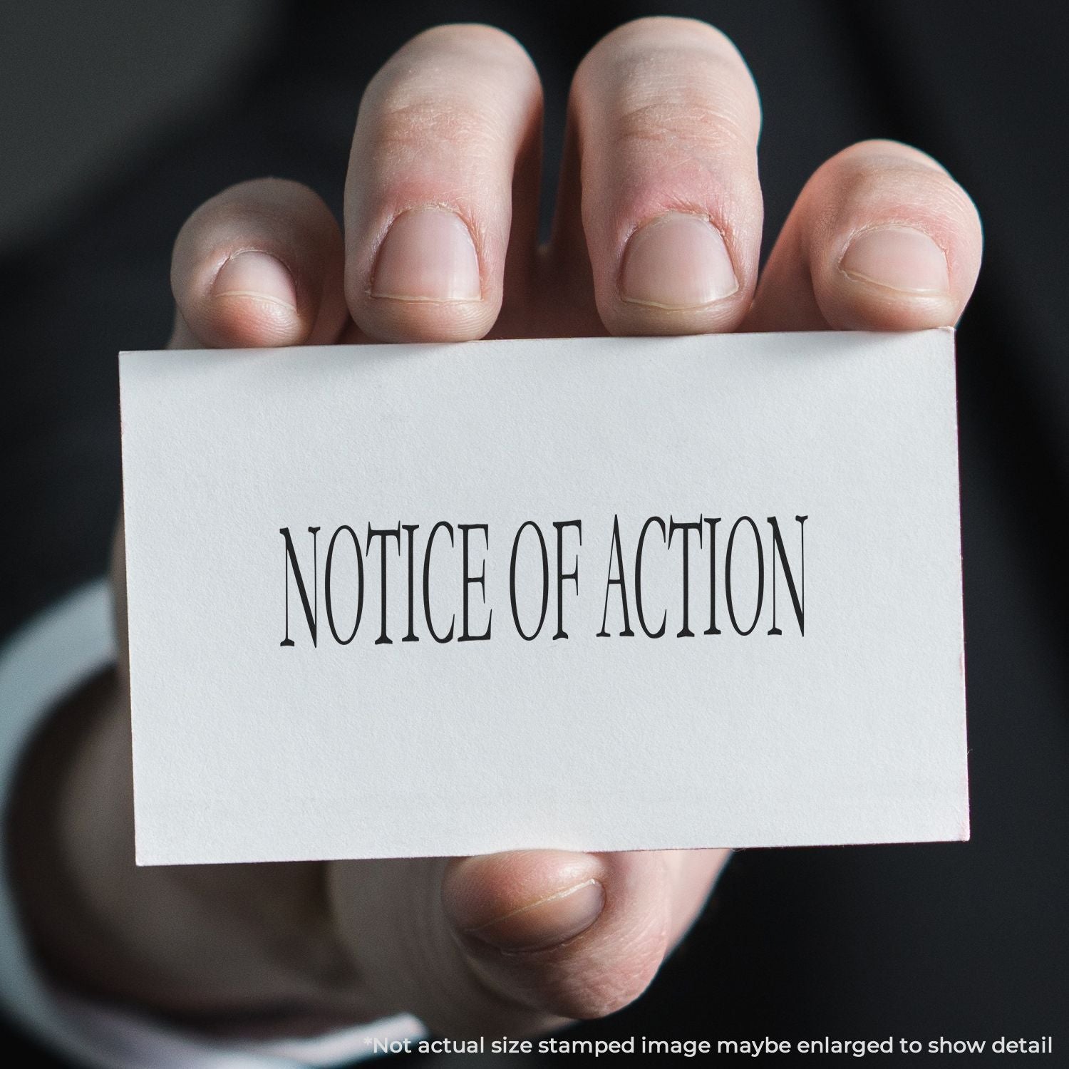 A self-inking stamp with a stamped image showing how the text "NOTICE OF ACTION" is displayed after stamping.