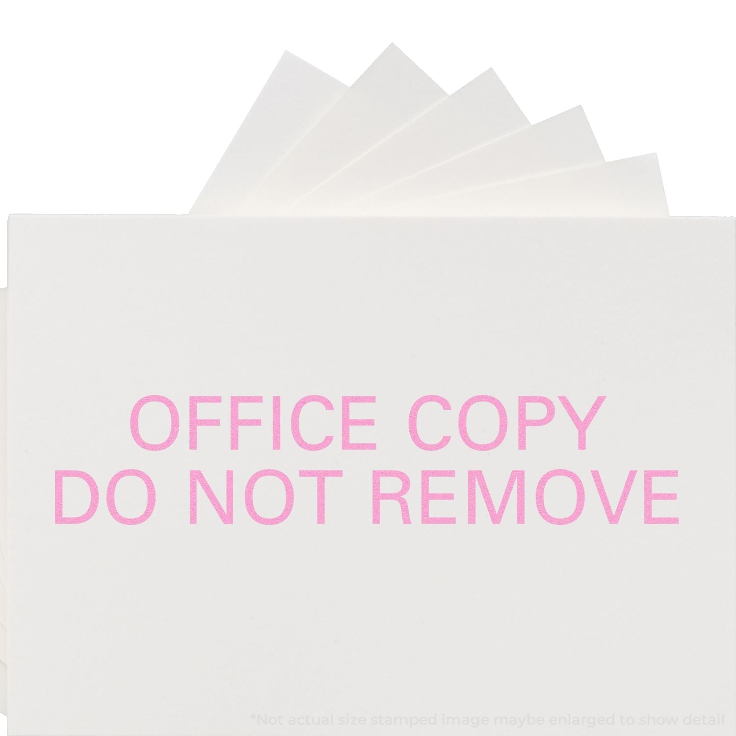 Self Inking Office Copy Do Not Remove Stamp in pink ink on white paper, with multiple sheets fanned out behind the stamped paper.