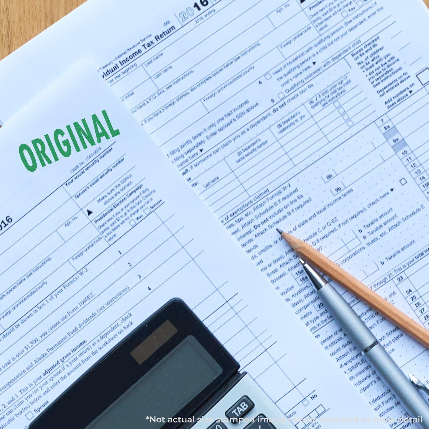 A Large Original Rubber Stamp marks a tax document labeled ORIGINAL in green, with a pencil, pen, and calculator nearby.