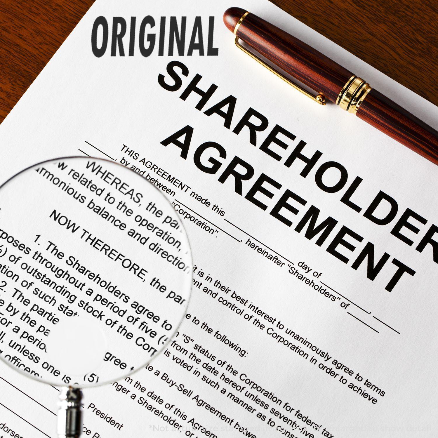 A Large Original Rubber Stamp marks ORIGINAL on a shareholder agreement document, with a magnifying glass and pen nearby.