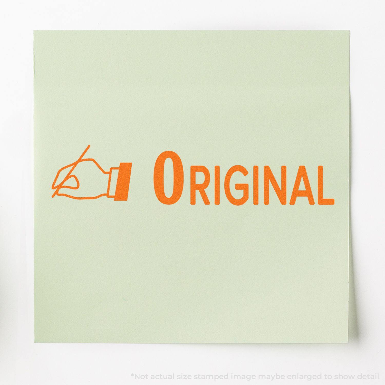 A green paper stamped with ORIGINAL in orange using the Large Original with Hand Rubber Stamp, featuring a hand holding a stamp icon.