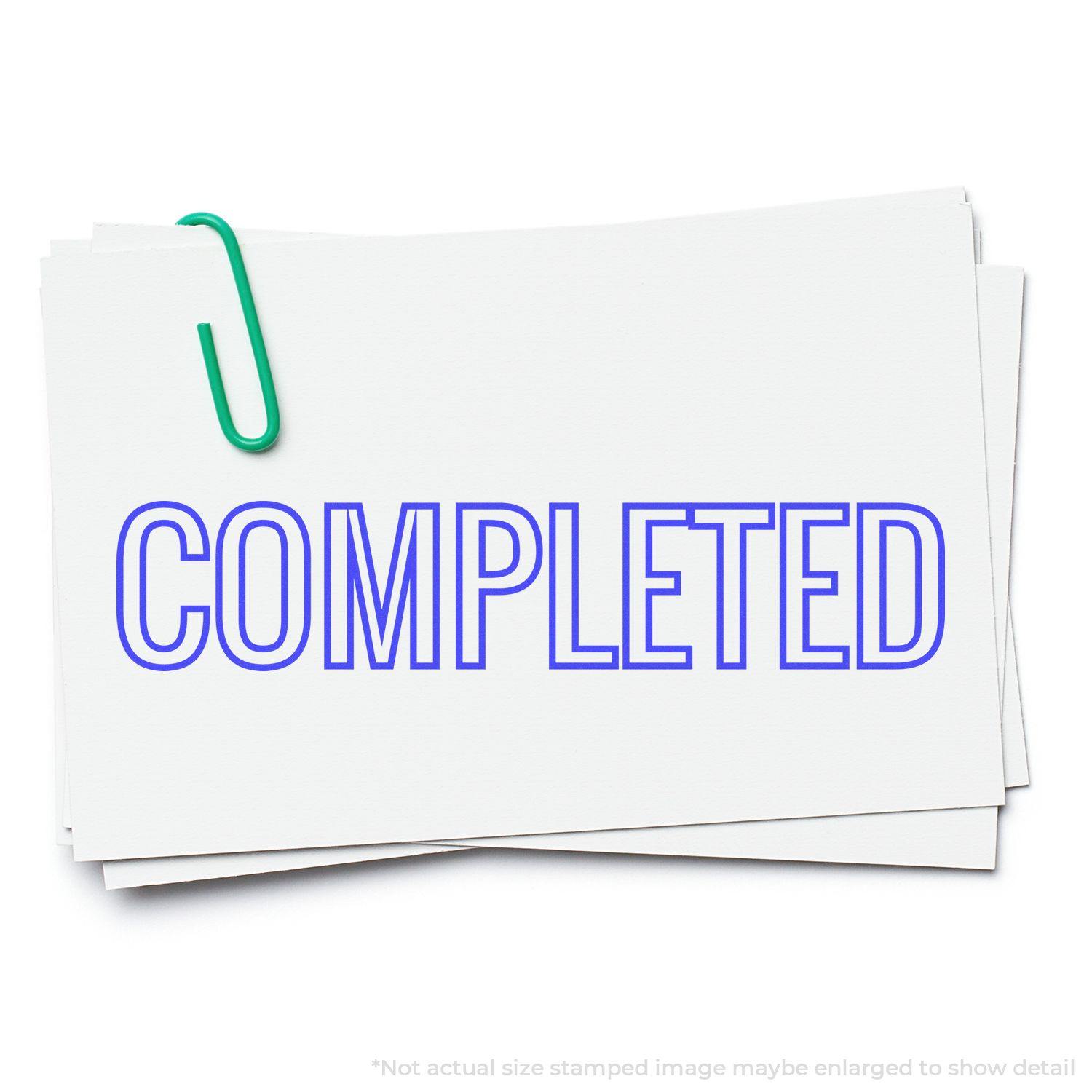 A stack of papers with a green paperclip, stamped with Outline Completed in bold blue letters.