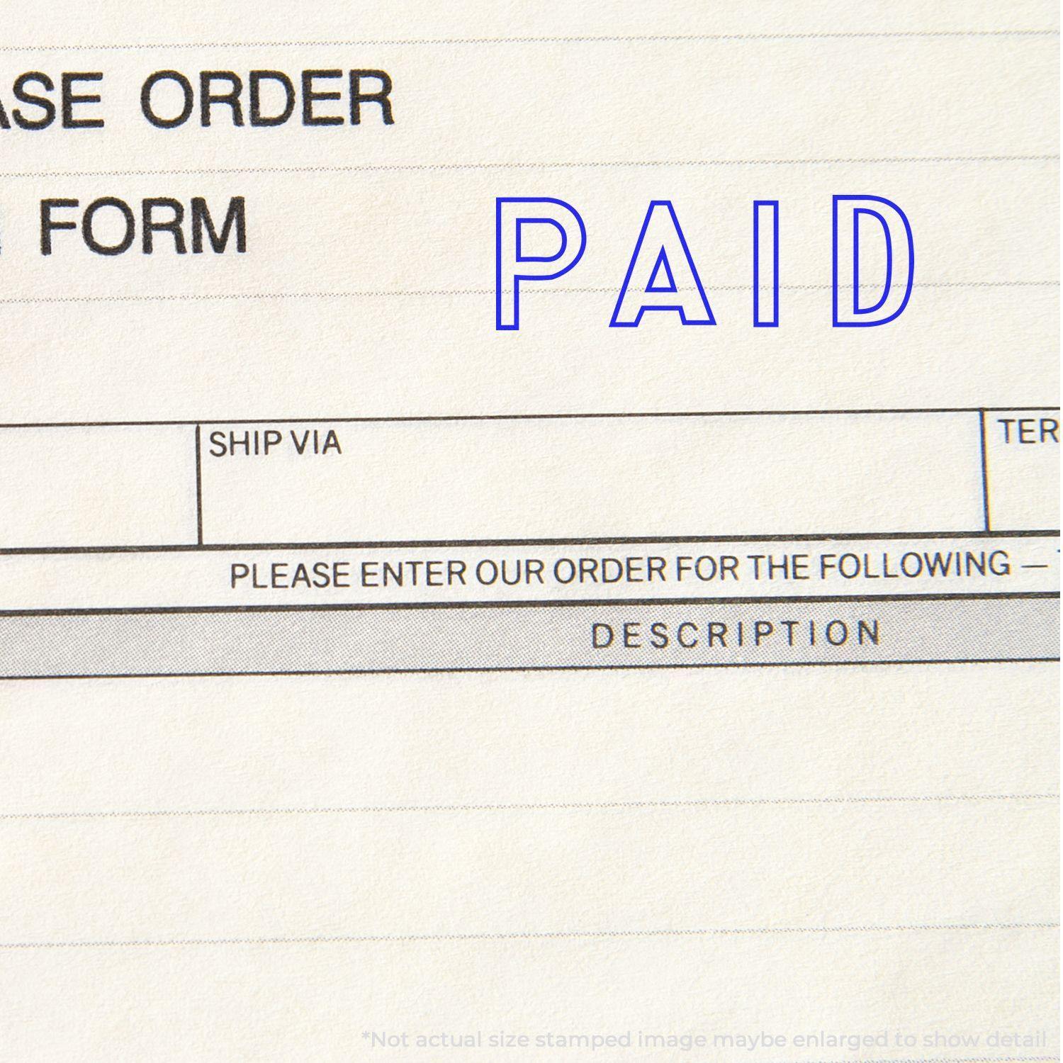 Outline Paid rubber stamp on a purchase order form, indicating payment has been made.