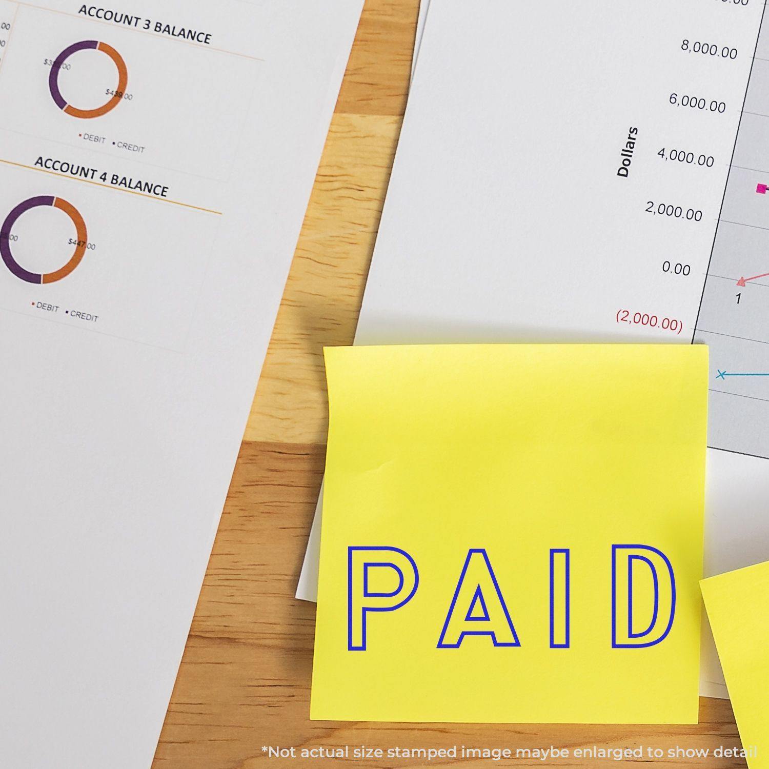 Outline Paid Rubber Stamp on a yellow sticky note, placed on financial documents with charts and account balances in the background.