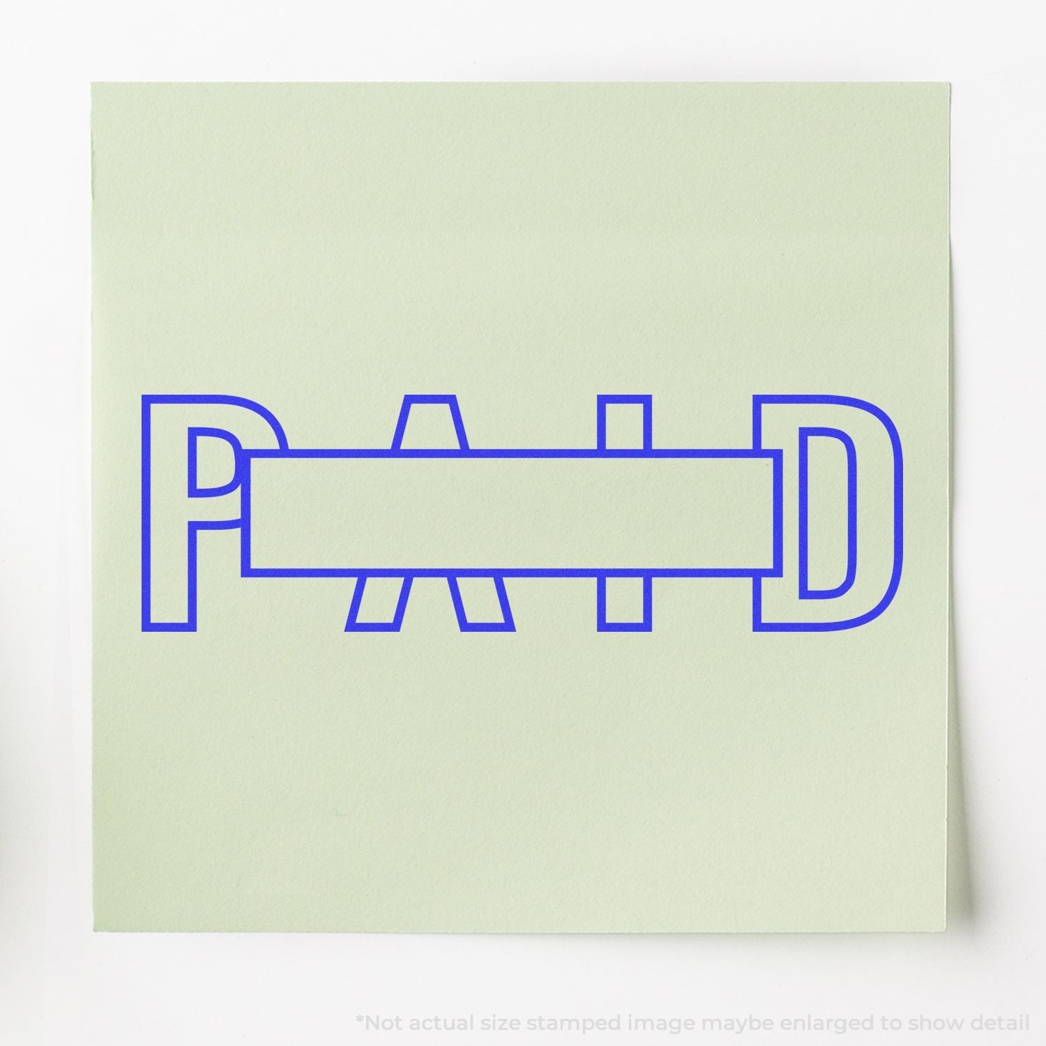 Self Inking Outline Paid with Box Stamp in blue ink on light green paper, showing the word PAID with a rectangular box in the center.