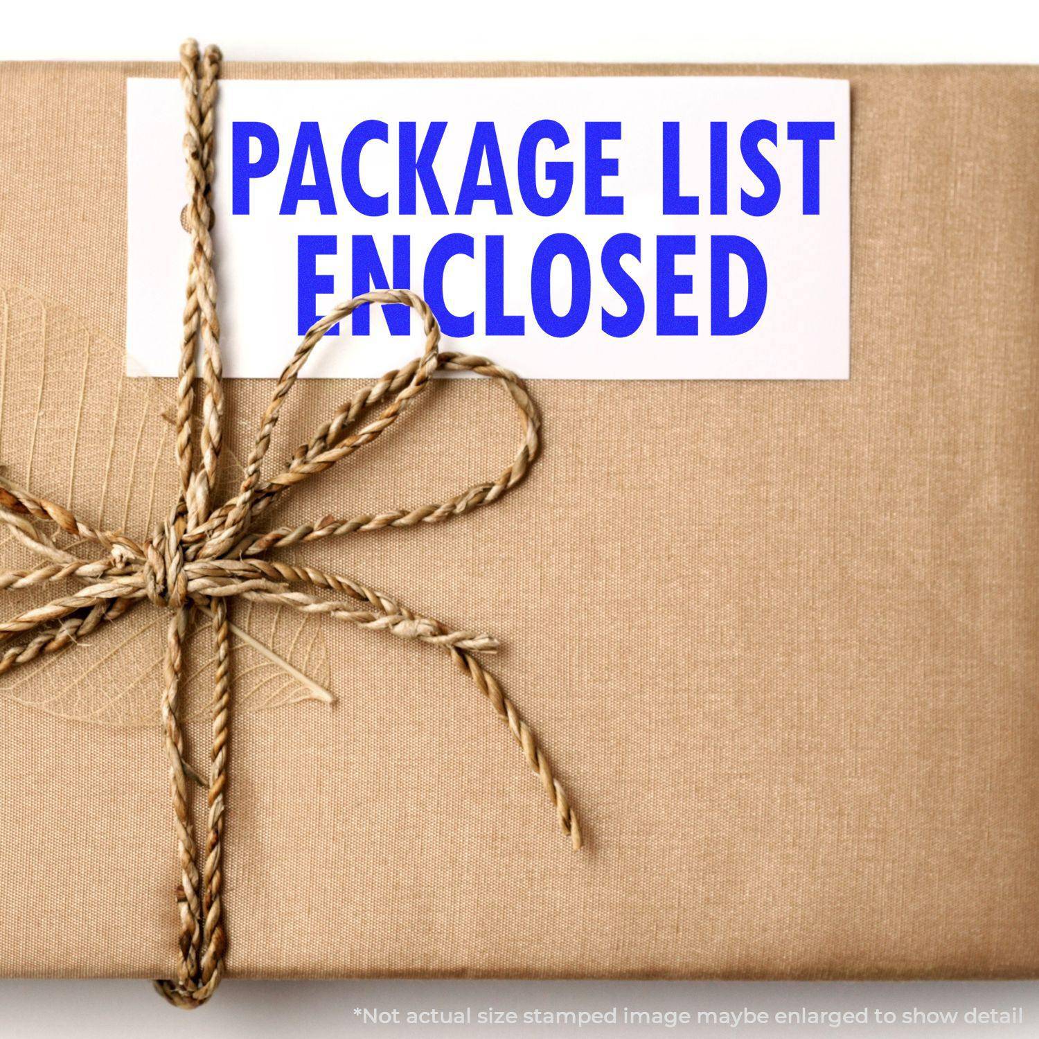 A brown package with a twine bow and a PACKAGE LIST ENCLOSED label stamped using the Large Package List Enclosed Rubber Stamp.