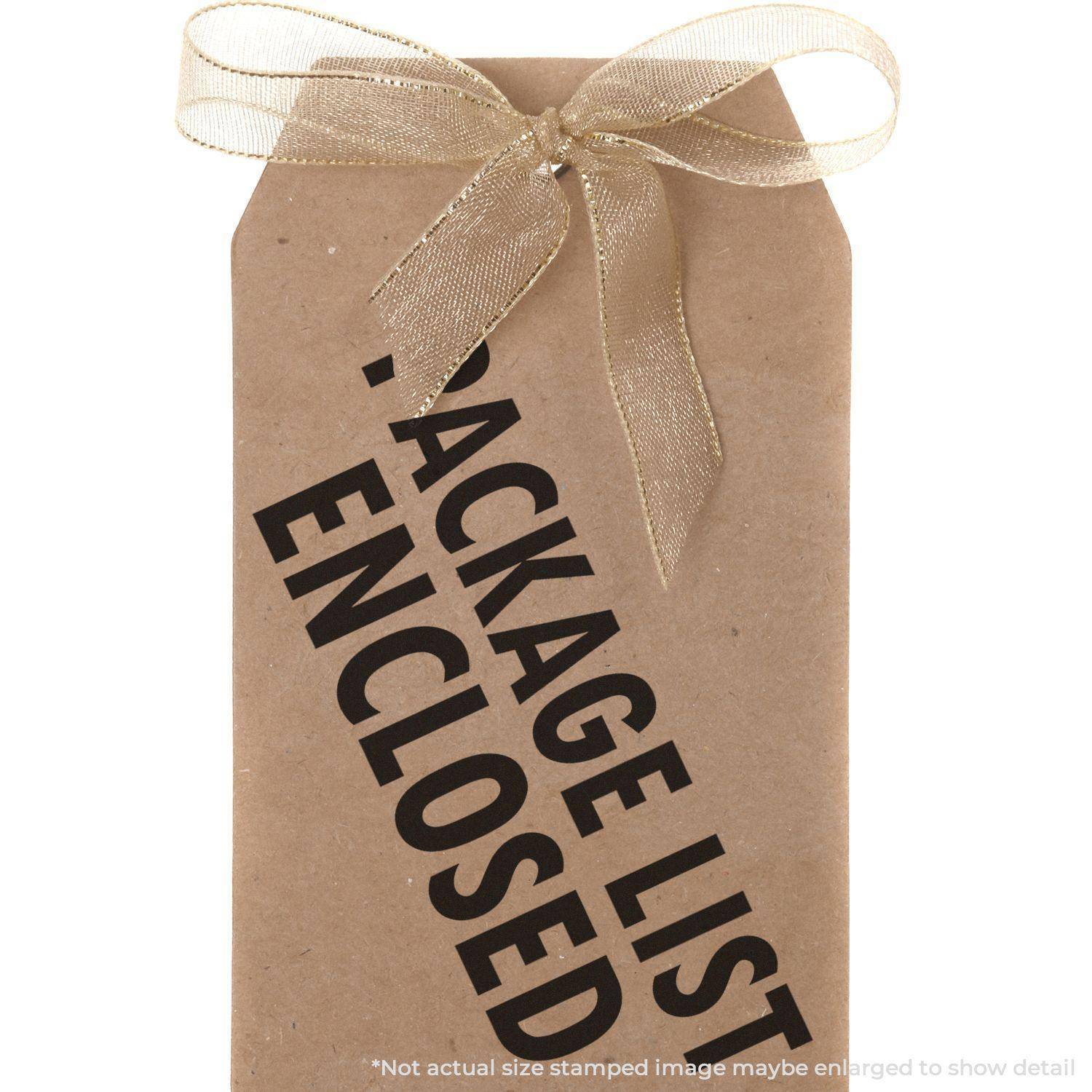 A brown tag with a gold ribbon stamped with PACKAGE LIST ENCLOSED using the Large Package List Enclosed Rubber Stamp.