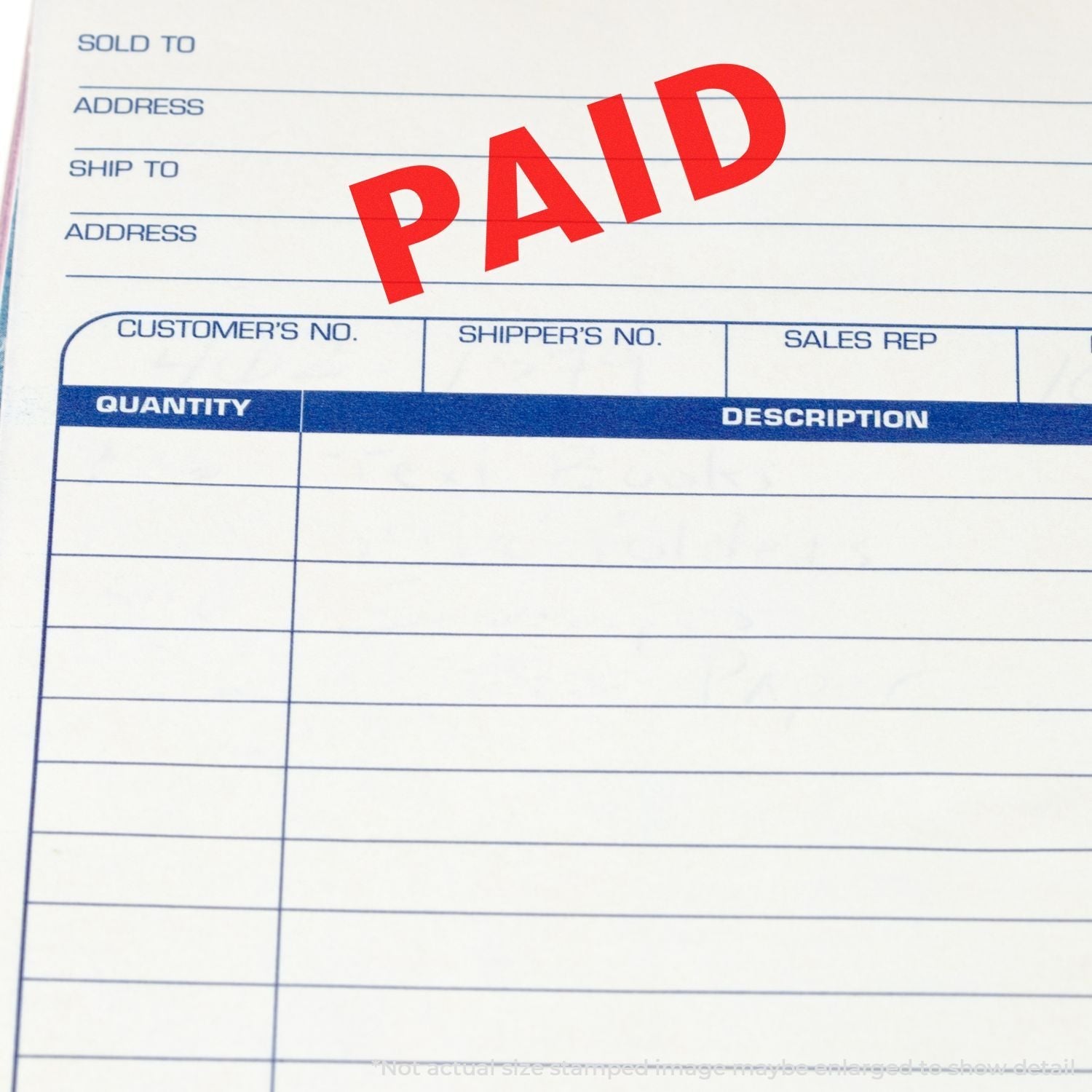 Self Inking Paid Stamp marking a document with a bold red PAID on a form with fields for customer, shipper, and sales rep details.