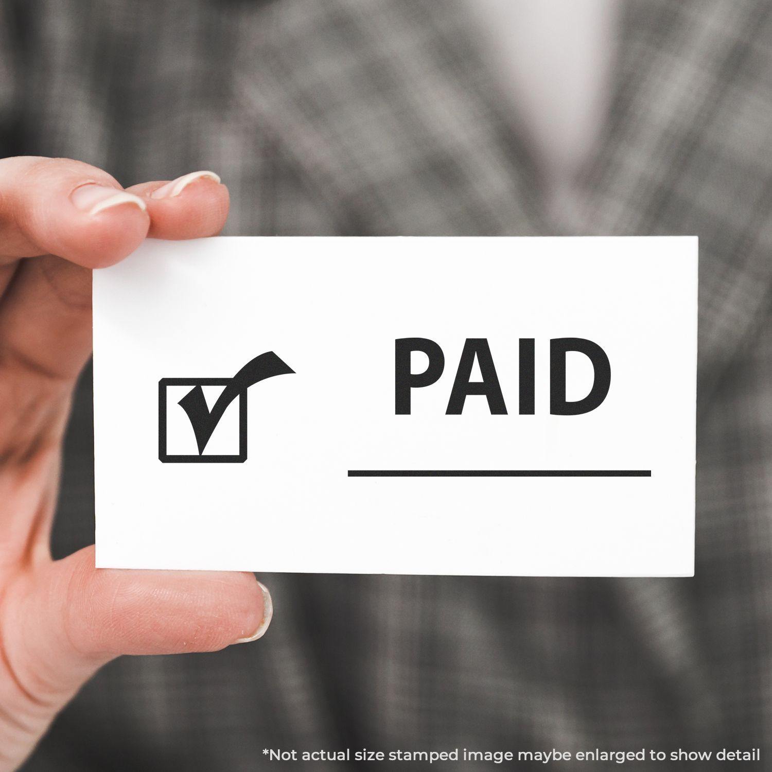 Person holding a card stamped with PAID and a checkmark using the Large Self Inking Paid with Checkmark Stamp.